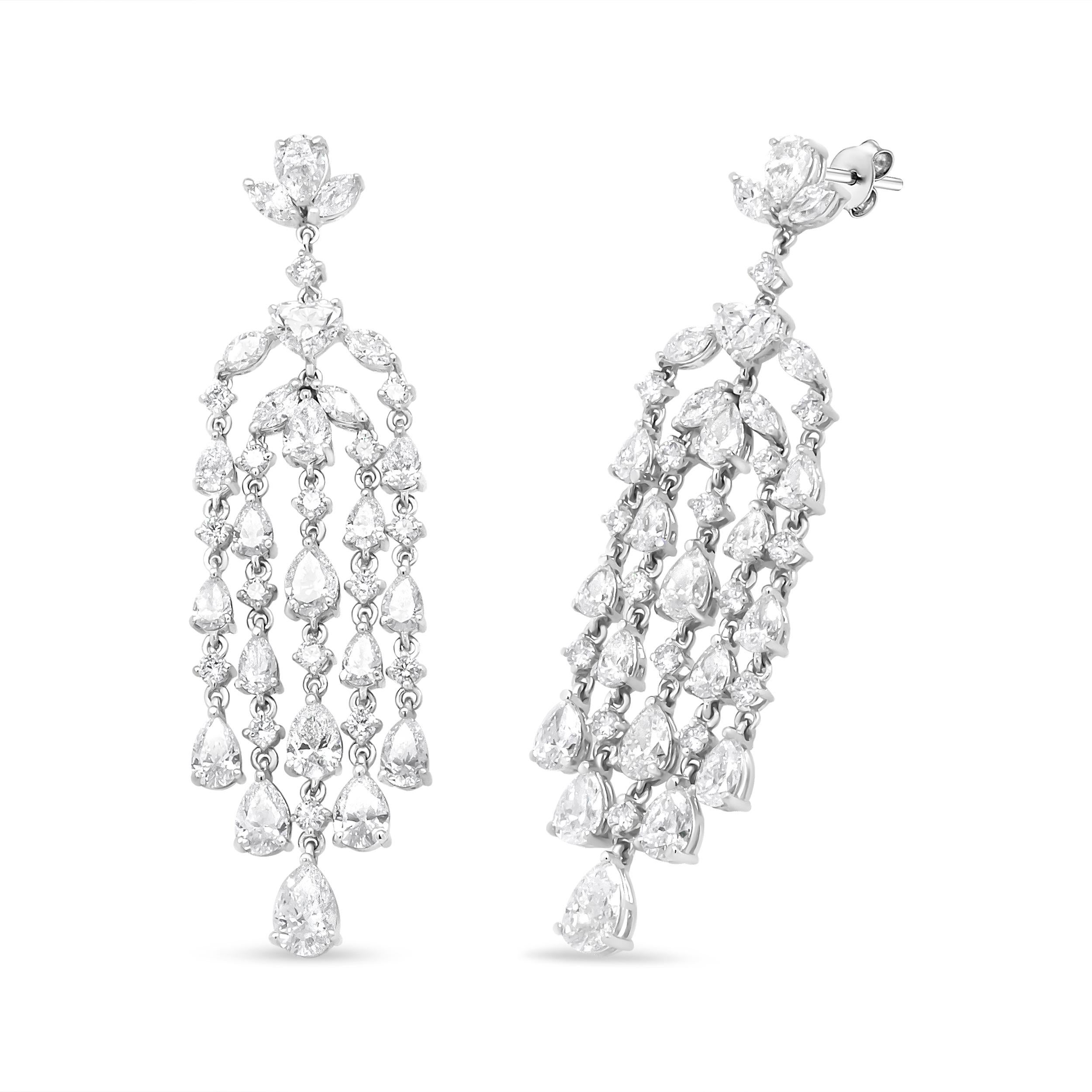 Indulge yourself with these dramatic diamond chandelier earrings for her. Polished in genuine 18k white gold, this jaw-dropping design beholds a captivating presentation of alluring diamonds that hold a total 11 1/8 cttw and an approximate VS1-VS2
