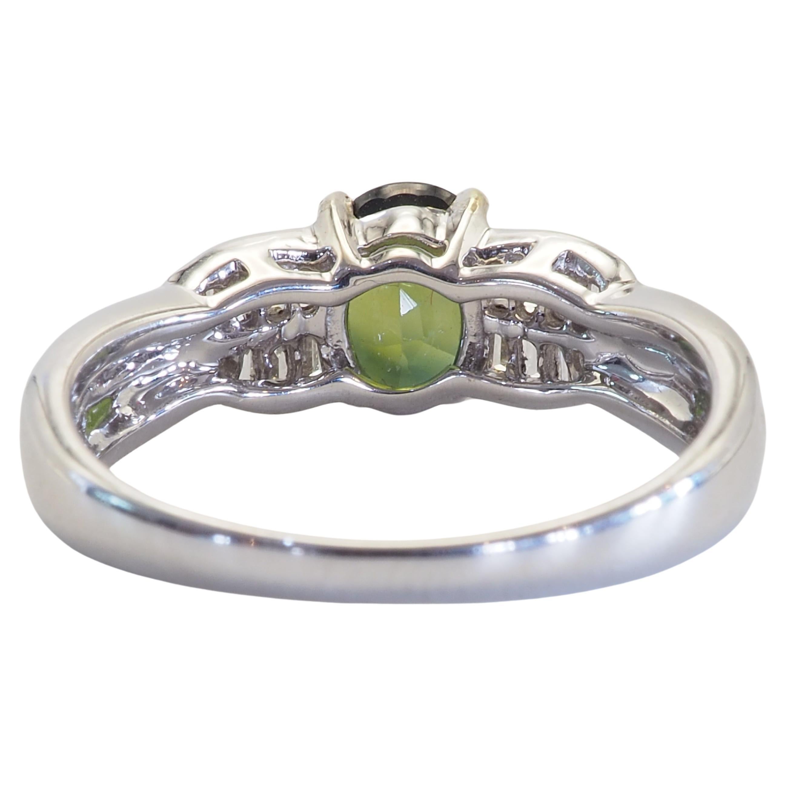 Oval Cut 18K White Gold 1.10ct Oval Green Sapphire & 0.26ct Baguette Diamond Ring For Sale