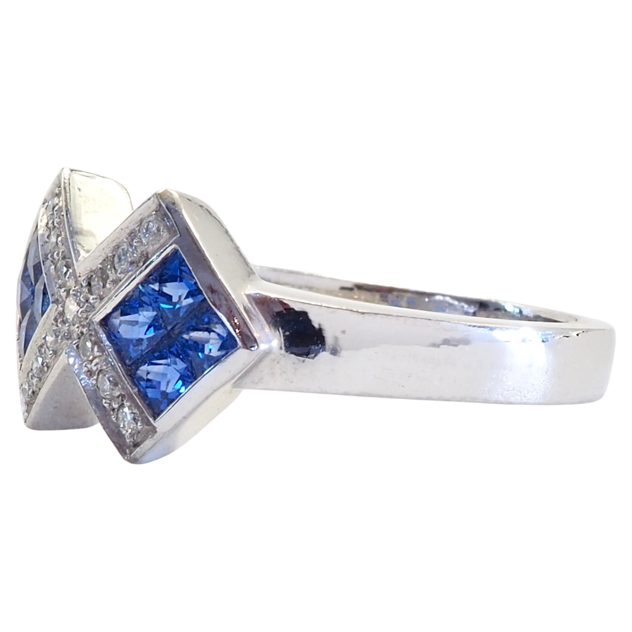 A fine Ceylon blue sapphire ring in a contemporary invisible abstract design. Very clean and bright color sapphire with awesome blue color with high clarity and surrounded by brilliant and decent size diamonds. Wide shank and perfect for wearing