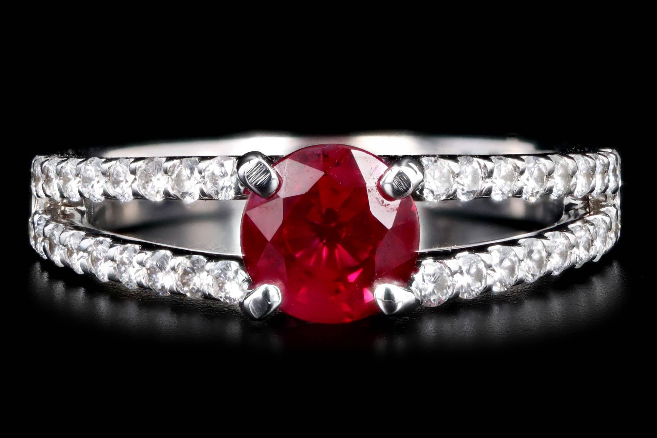 Era: New

Composition: 18K White Gold

Primary Stones: Round ''Pigeon's Blood'' Natural Ruby

Origin: Burma

Carat Weight: 1.22 Carats

GIA Certified: 6227421831

Accent Stone: Thirty Six Round Brilliant Cut Diamonds

Carat Weight: Approximately