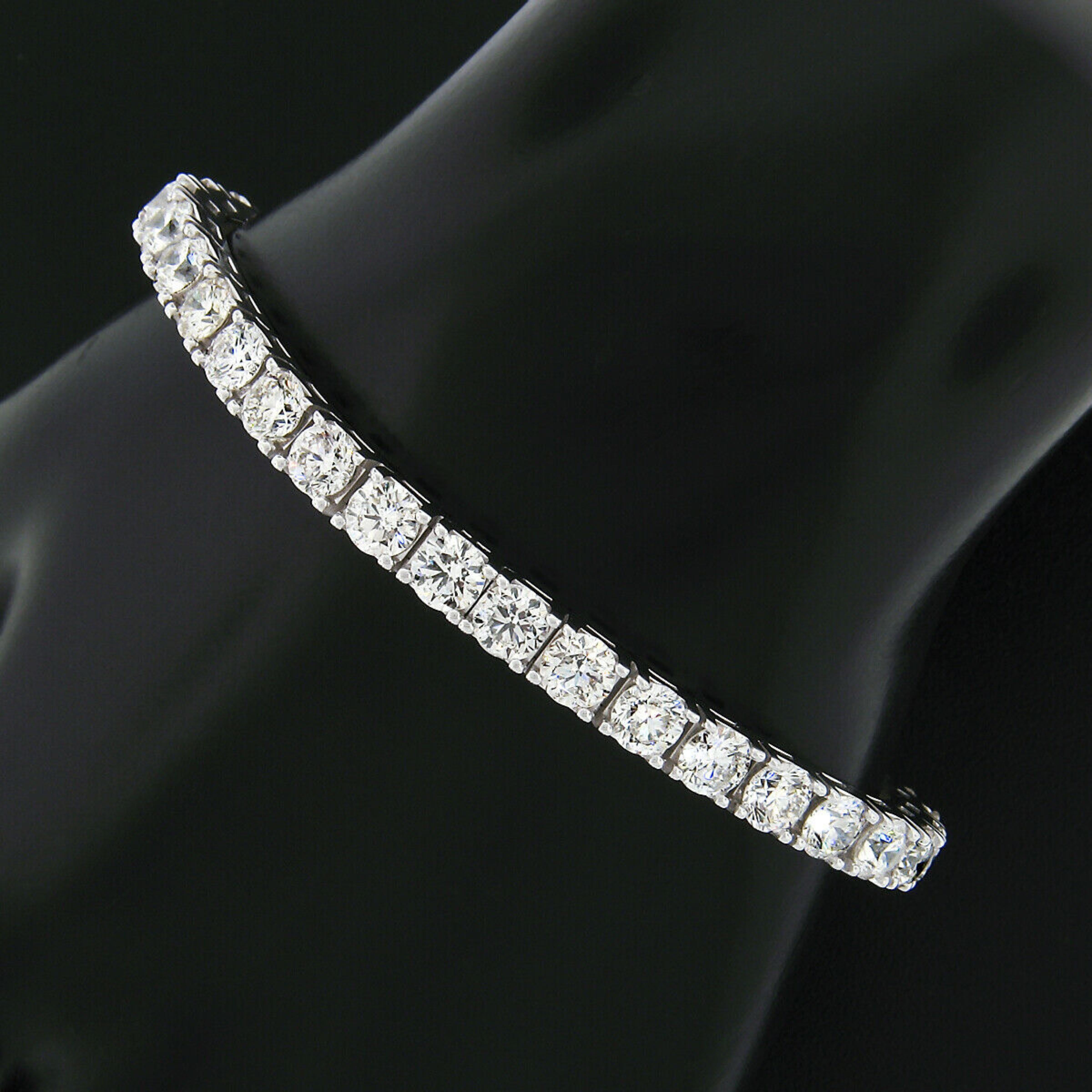 This breathtaking diamond statement tennis bracelet is newly crafted in solid 18k white gold and set with 37 fine quality and large round brilliant cut diamonds. The diamonds are mounted in solid and sturdy, squared 4-prong baskets with the most