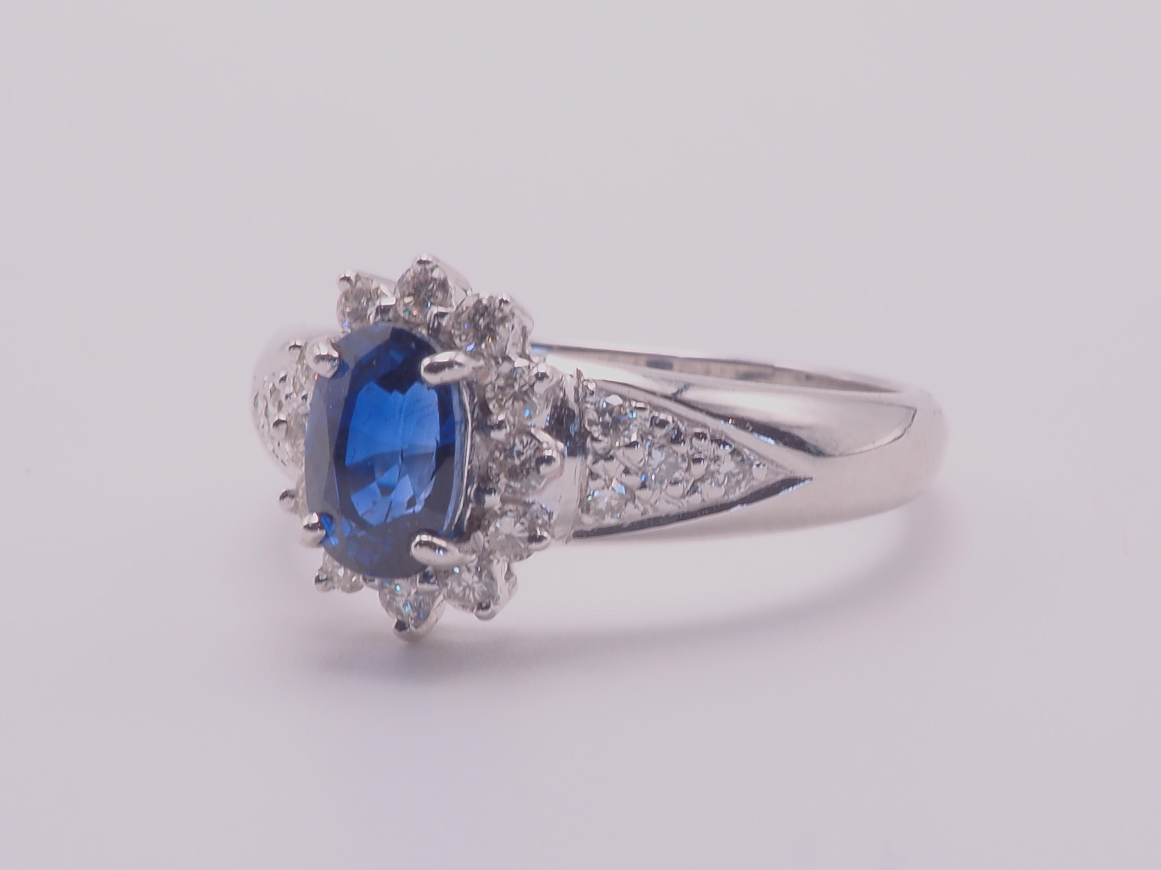 A finely crafted sapphire and diamond engagement ring. Beautiful oval blue sapphire of 1.26 carats set in the middle nicely. The blue gemstone has great brilliance with strong saturation which can be visible to some degree in the shadows, very clear