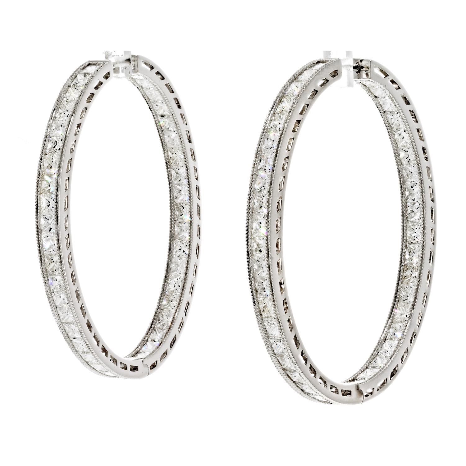 The 18K White Gold 12.87cttw Princess Cut Diamond Inside Out Hoop Earrings are a dazzling and luxurious accessory that exude elegance and style. These hoop earrings feature a stunning display of diamonds, mounted both inside and out, in a channel