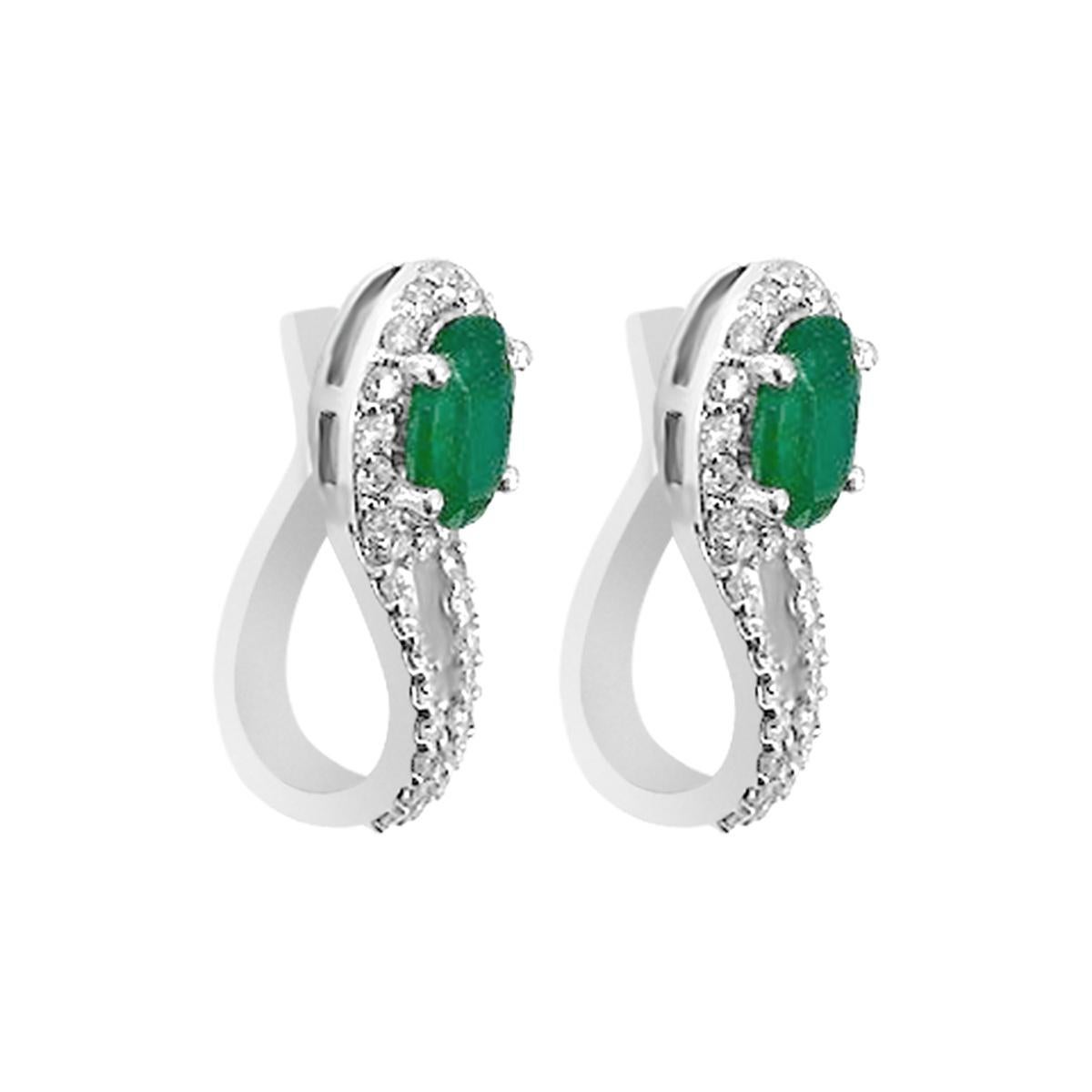 These Dangle Earrings Are The True Definition Of Art And Precision.
Exquisite Oval Shaped 7x5mm Emerald And Diamond Dangle Earring In 18K White Gold.
Intense Green Emerald Accentuated With Diamonds Are Set In An Artistic Way To Complete An Amusing