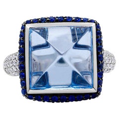 18K White Gold & Blue Topaz Ring with Blue Sapphire Halo and Diamond Shank