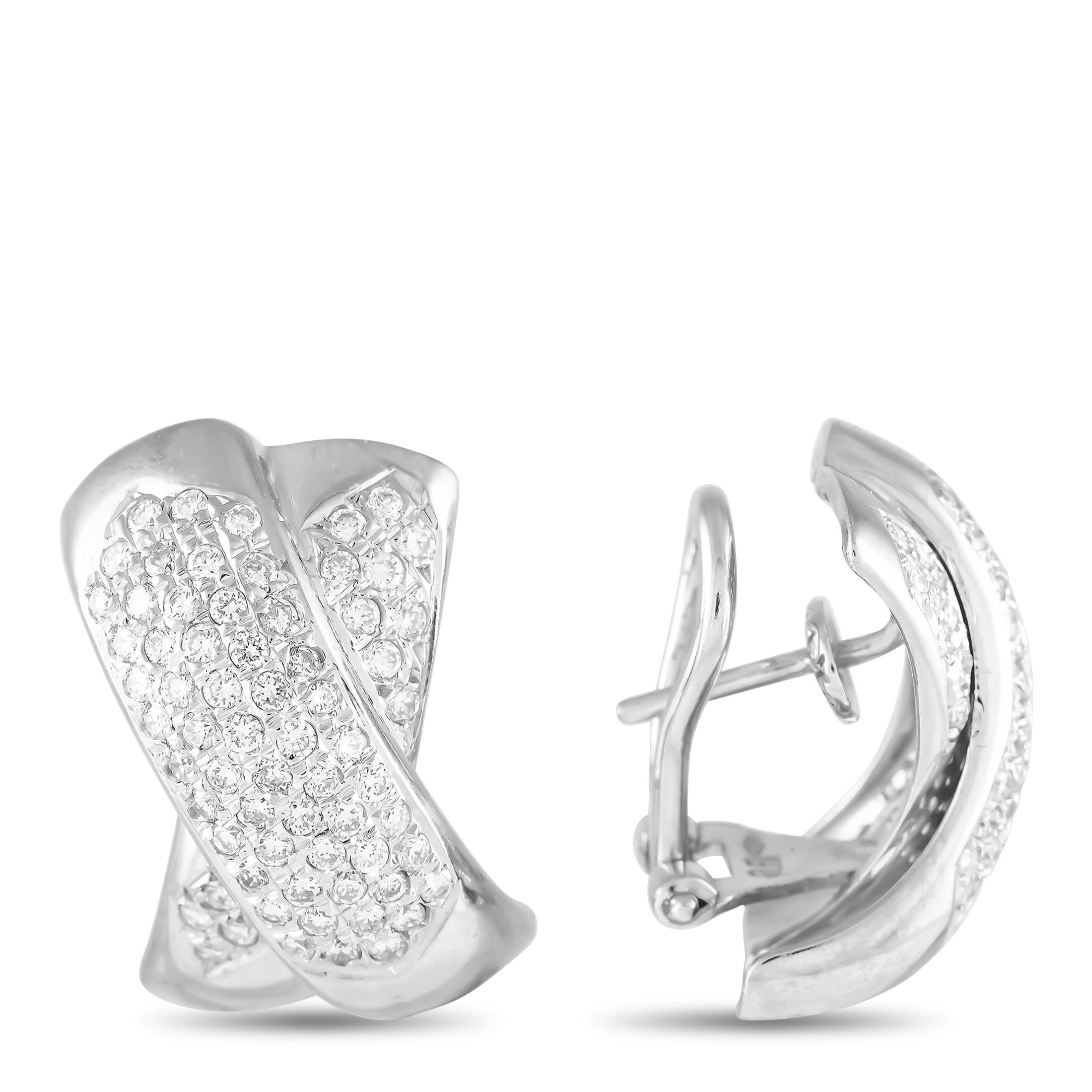 These 18K White Gold earrings are timeless in design. Inset Diamonds with a total weight of 1.30 carats allow them to positively radiate light. Each one measures 0.75 long by 0.50 wide, making them perfect for any occasion.This jewelry piece is
