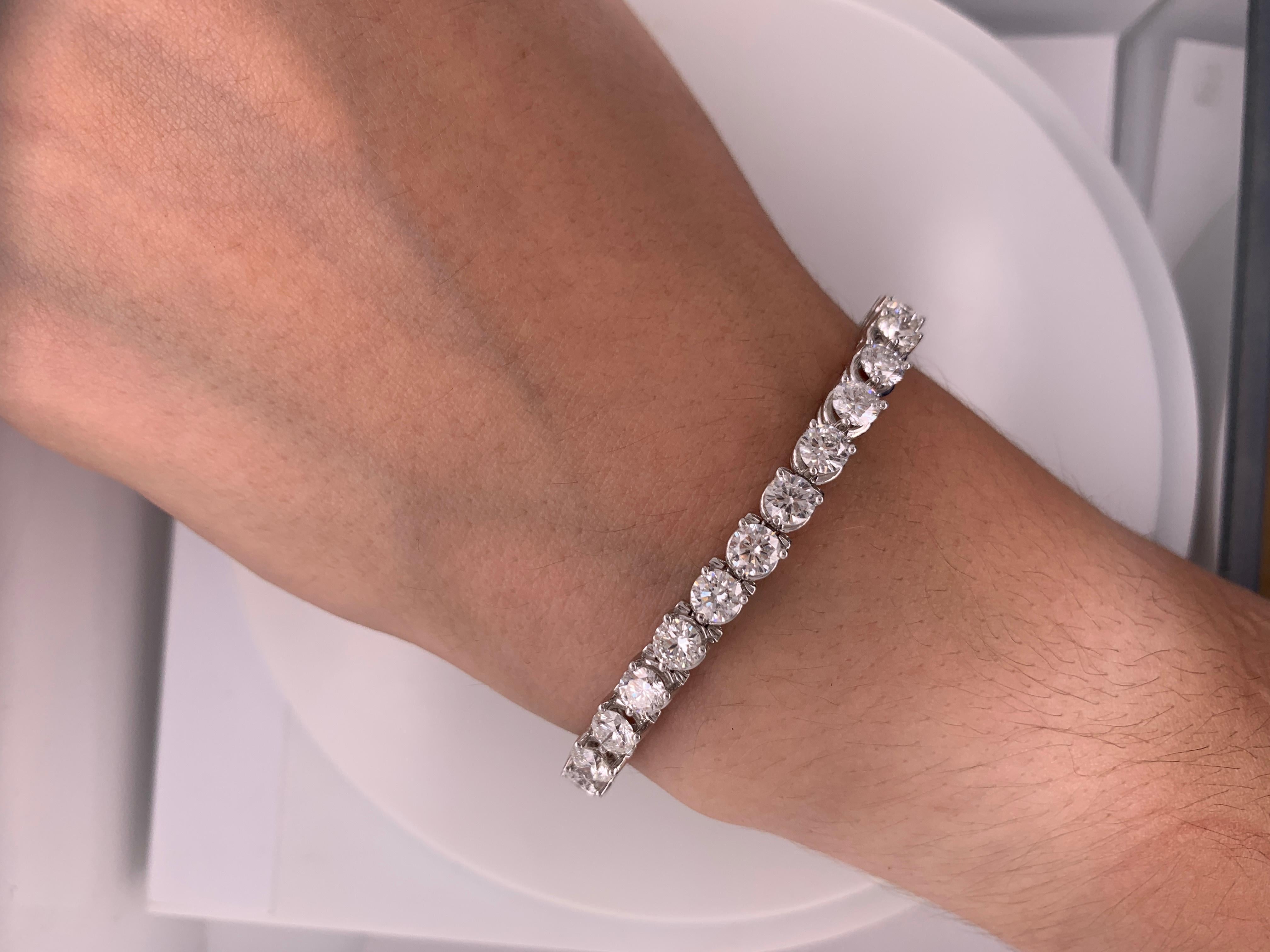 Stunning diamond tennis bracelet in three prong white gold diamond mounting! 

32 Round brilliant cut diamonds, totaling 13.20 Carats. Each stone approx. 0.41 Carats. set in very delicate, timeless 18K White gold diamond mounting. 

Diamond
