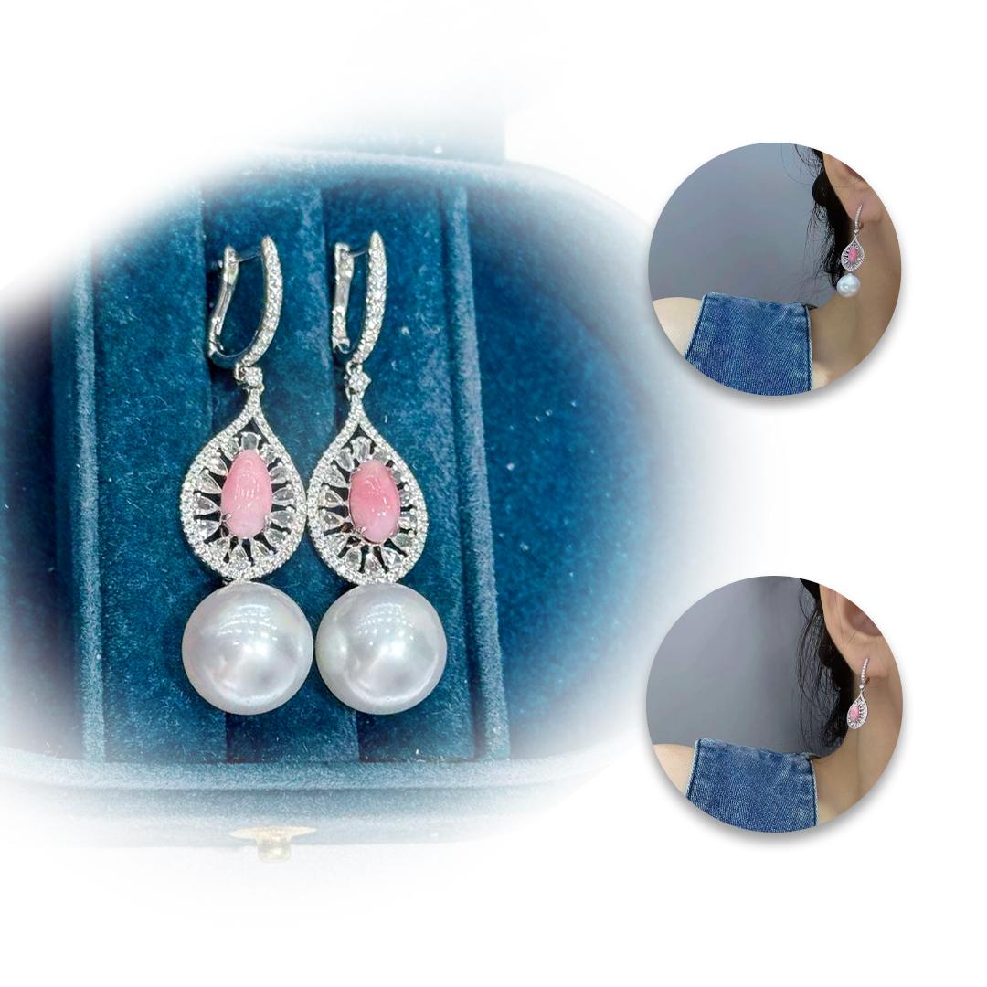 A versatile celebration of elegance, these convertible earrings feature flamingo pink conch pearls (2.45ct total) set within a halo of brilliant diamonds (1.35ct total), forming a radiant teardrop silhouette. Each earring transforms