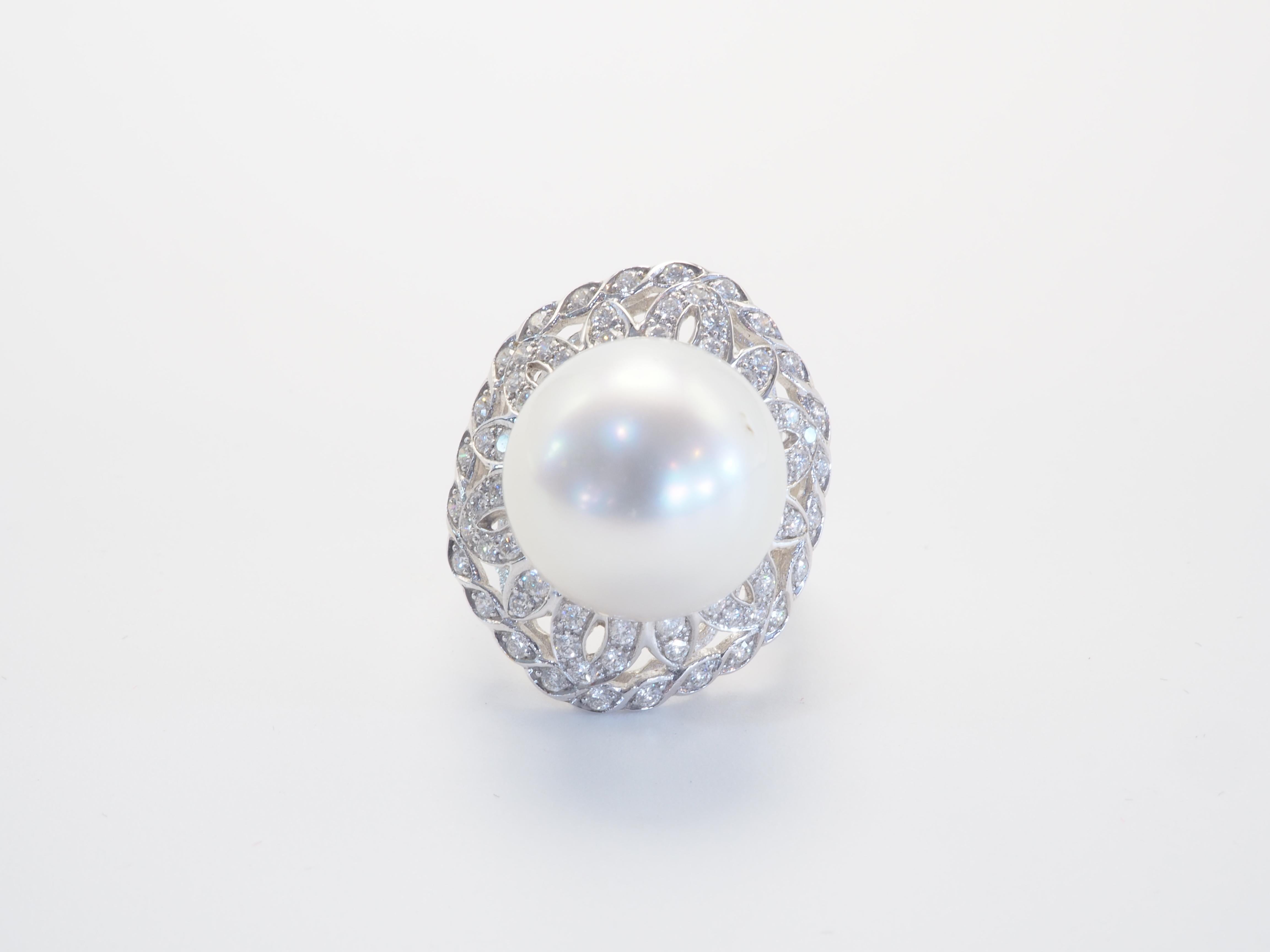 This brilliant 18k with gold ring is adorned with a rare and beautiful South Sea pearl! The pearl is lustrous white and is round/ mixed free form and has a visible blemish as seen in the first picture- one in particular. The diameter of the pearl is