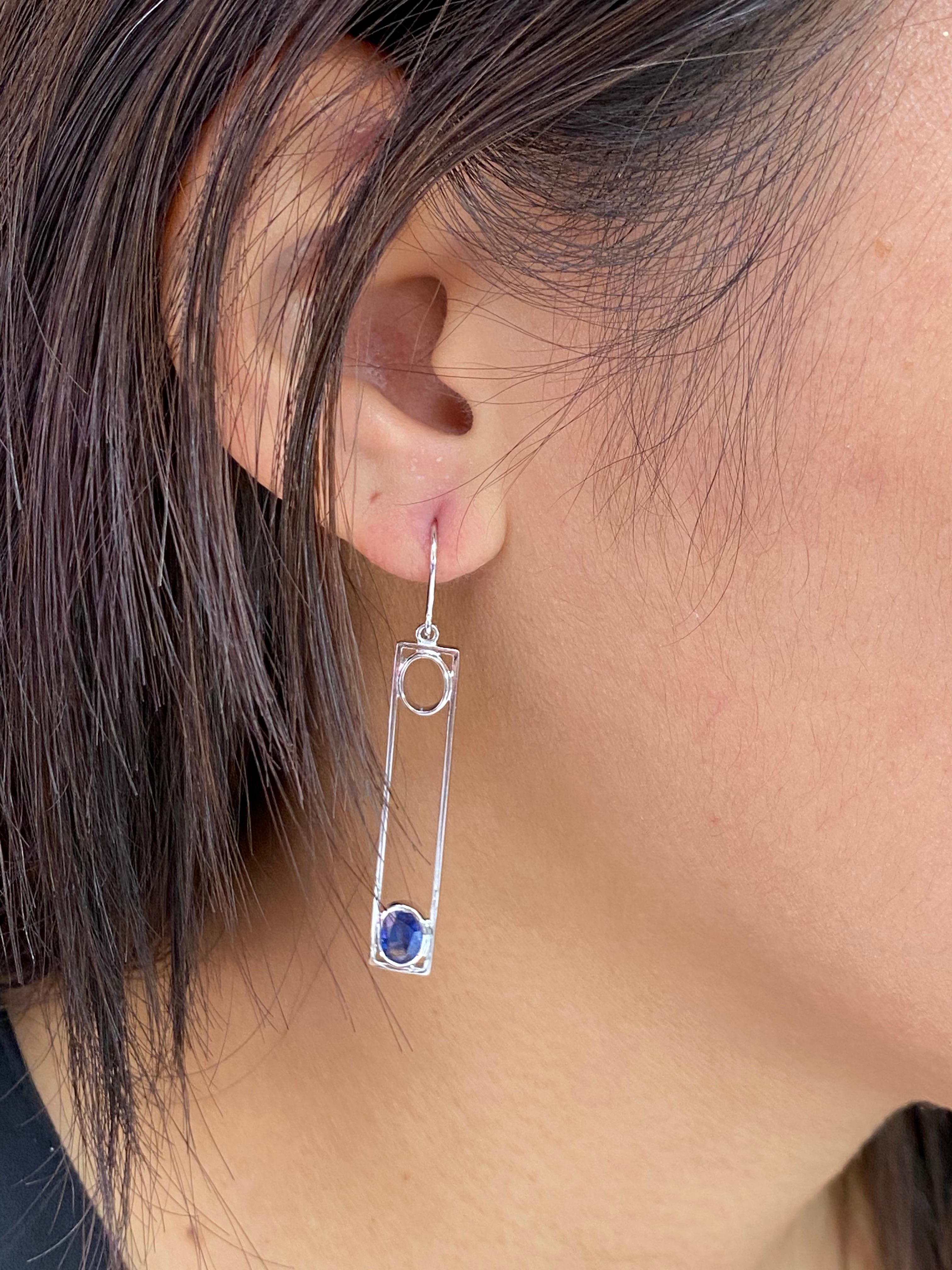Here is a very nice pair of Sapphire drop earrings. The design is superb. The earrings are set in 18k white gold. Simple and elegant. the 2 oval shaped sapphires weight a total of 1.44cts. You can spot these drop earrings from far away. You can't
