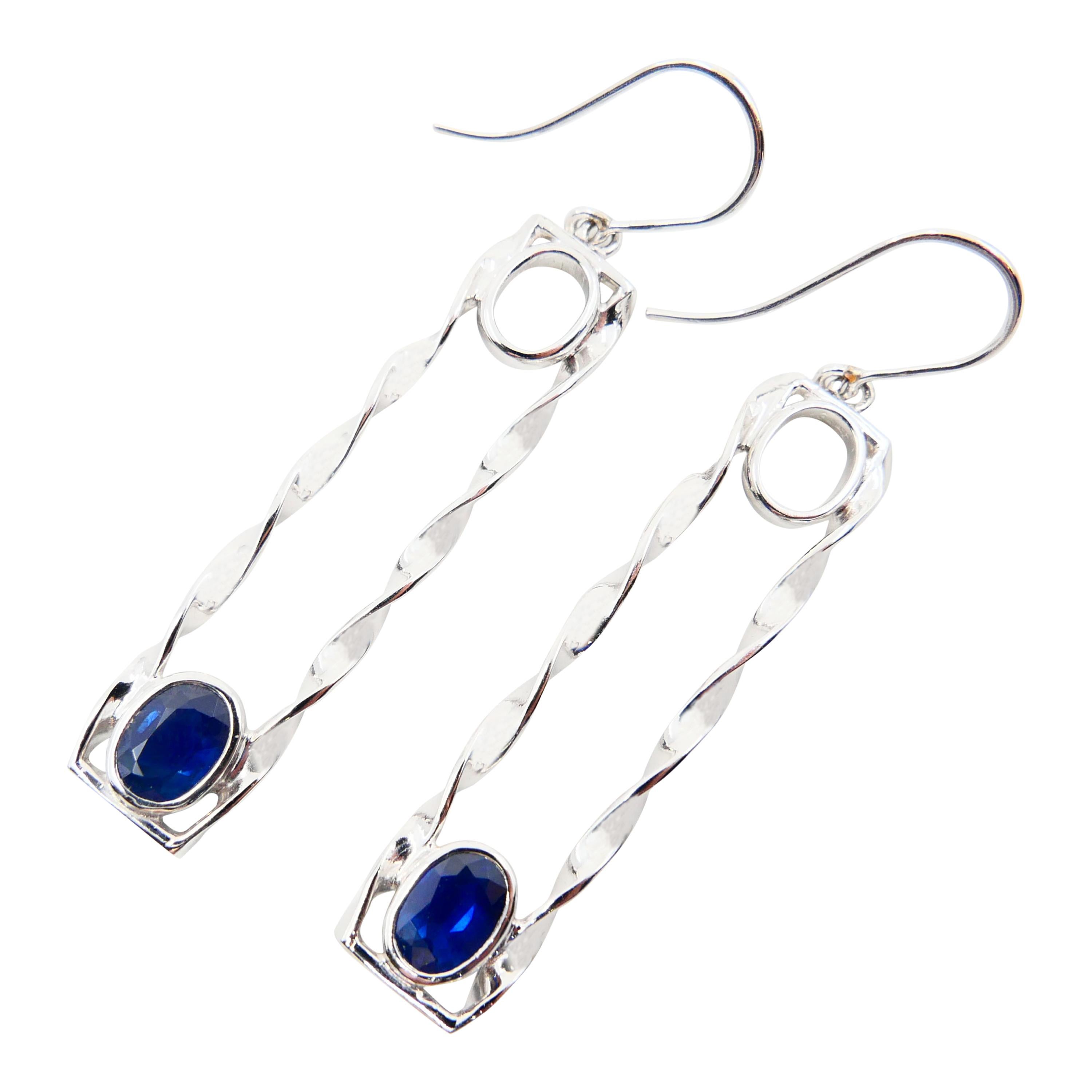 Oval Cut 18 Karat White Gold 1.45 Carat Blue Sapphire Drop Twist Earrings For Sale