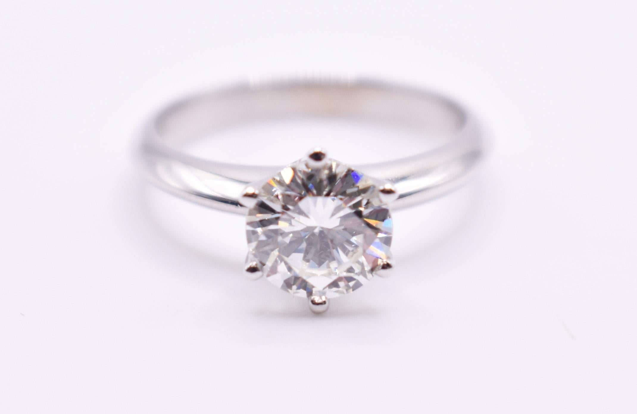 On offer for sale is a splendid 1.46ct 18K white gold Tiffany style diamond engagement ring. 

Metal: 18K White Gold
Total Carat Weight: 1.46
Colour: I
Clarity: VS2
Size: US= 6 1/2 UK= N