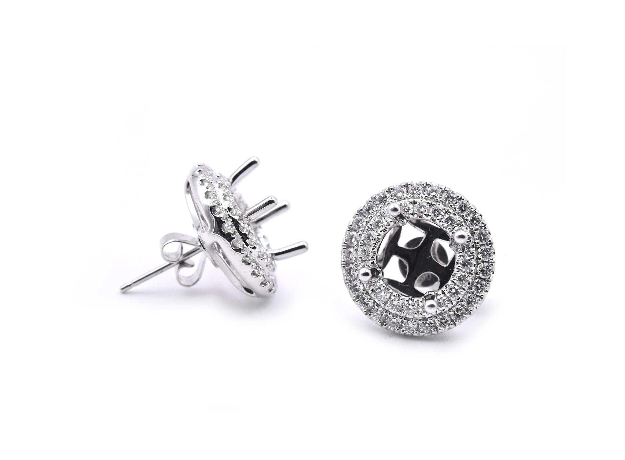 Designer: custom designed
Material: 18k white gold
Diamonds: 90 round brilliant cuts = 1.46cttw
Color: G
Clarity: VS2-SI1
Dimensions: earrings measure 16mm in diameter, jackets can hold an 8.5mm center stone or a 2.50 carat diamond each
Fastenings: