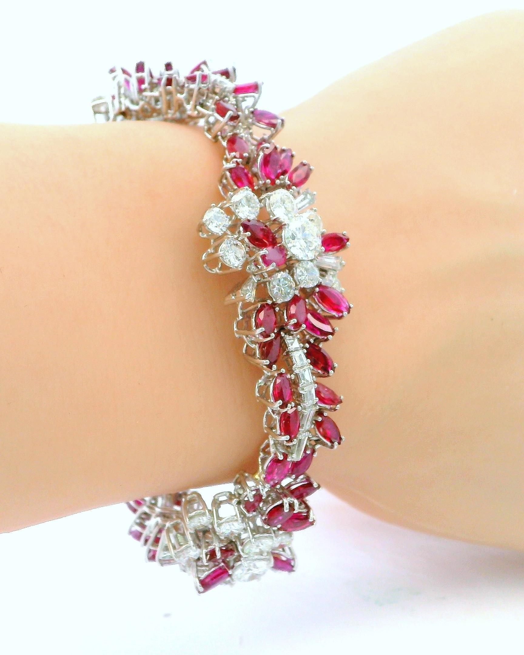 This exquisite bracelet is crafted from 18K white gold and features a stunning array of vibrant 19ct red rubies and 14ct brilliant round-cut diamonds. The intricate design features clusters of gemstones that create beautiful floral motifs, offering
