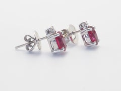 18k White Gold 1.50ct Vivid Red Oval Ruby & 0.05ct Diamond Stud Earrings