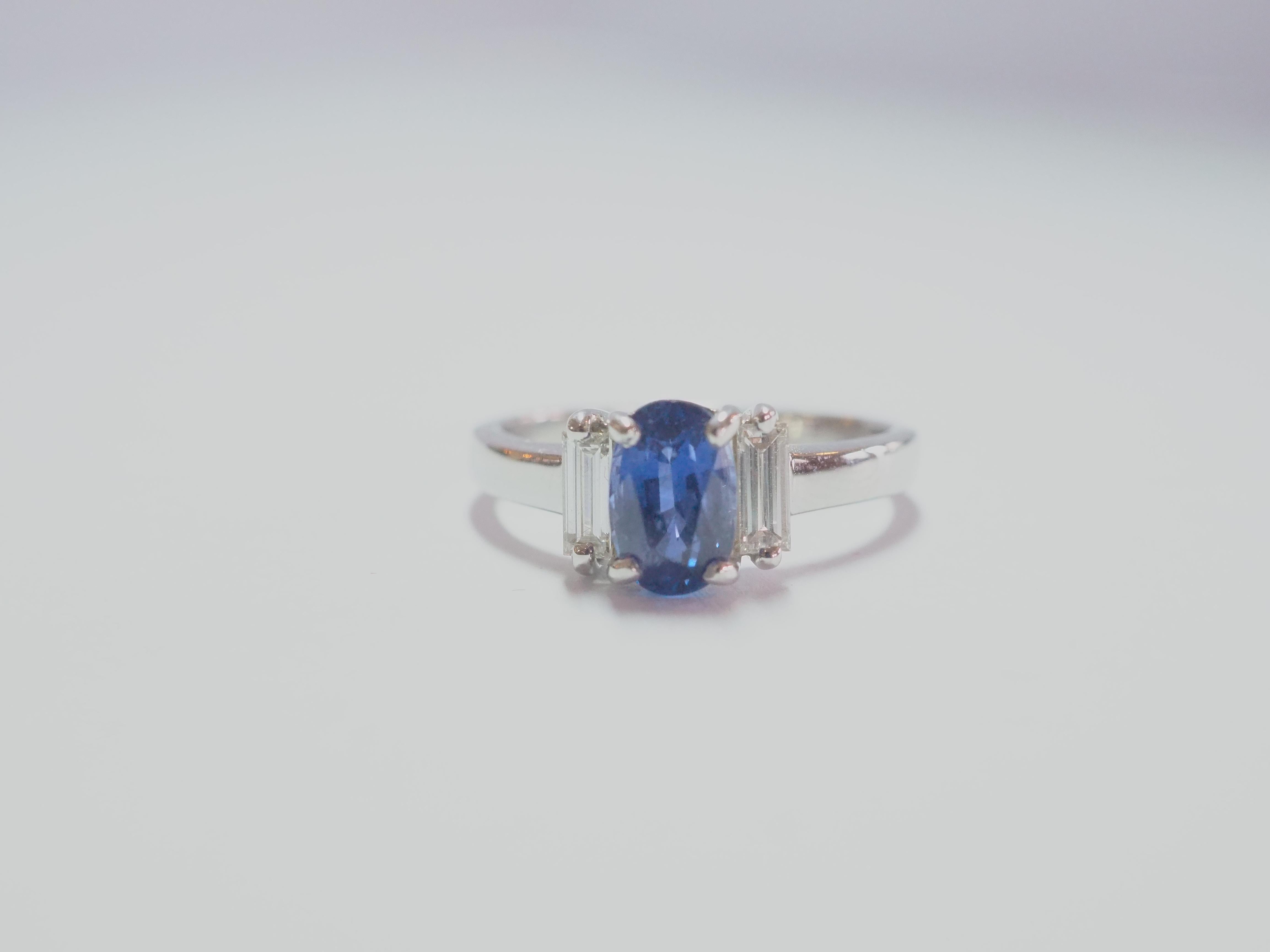A finely crafted sapphire and diamond engagement ring. Beautiful oval blue sapphire of 1.60 carats set in the middle nicely. The blue gemstone has great brilliance and fire with very slight inclusion, very clear upon inspection by eye. There 2