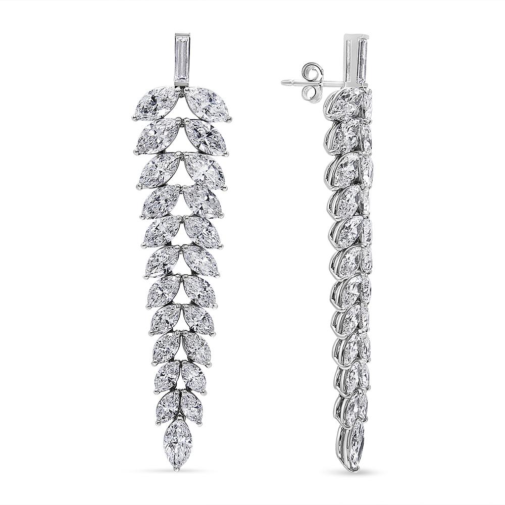 These opulent 16.00 ct. t.w. diamond cluster chandelier earrings are beyond breathtaking! The earrings start with a bale, channel set with a slender baguette diamond. From there the earrings fan out with a symmetrical chandelier with 22 marquise
