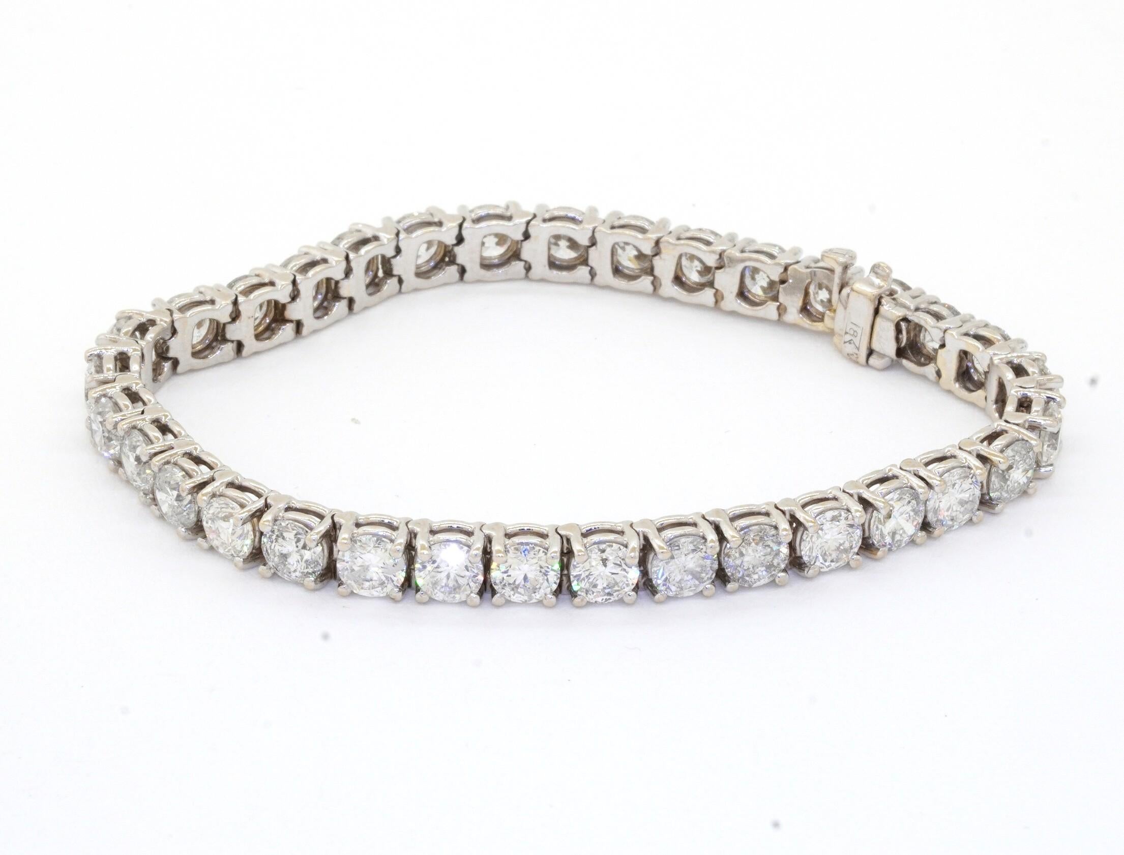 Heavy 18K white gold 16.50CT diamond tennis line bracelet w/ 0.50CT diamonds! This fashionable piece of jewelry is crafted in beautiful 18K white gold and features 33 diamonds (SI2 - I1 clarity/G - H color) with a combined weight of approx. 16.50CT.