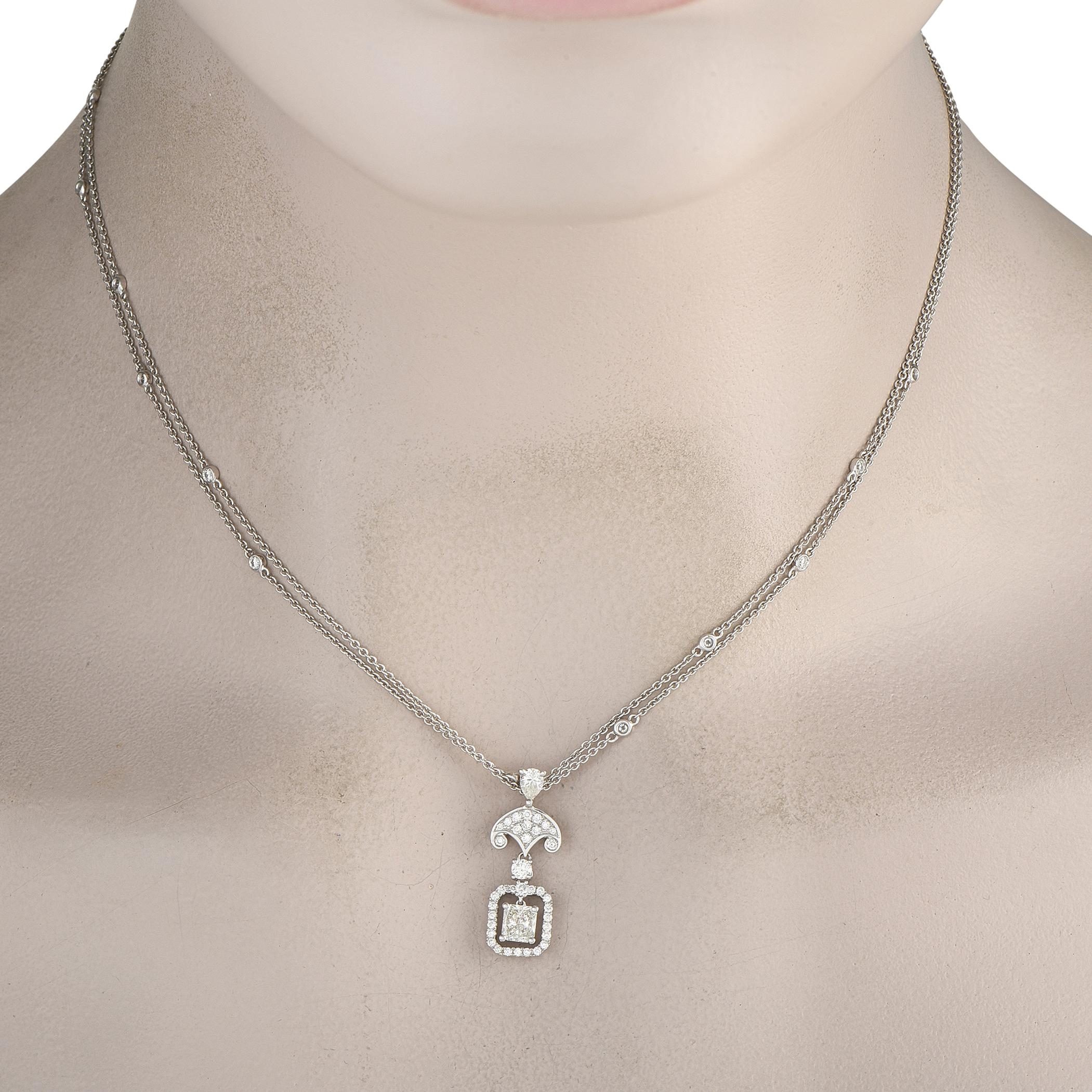 Elegant and incredibly sophisticated, this 18K White Gold necklace will elevate any ensemble. An ornate pendant measuring 1.0 long by 0.38 wide makes a statement at the center of a double-layered 16 chain. Diamonds with a total weight of 1.65 carats