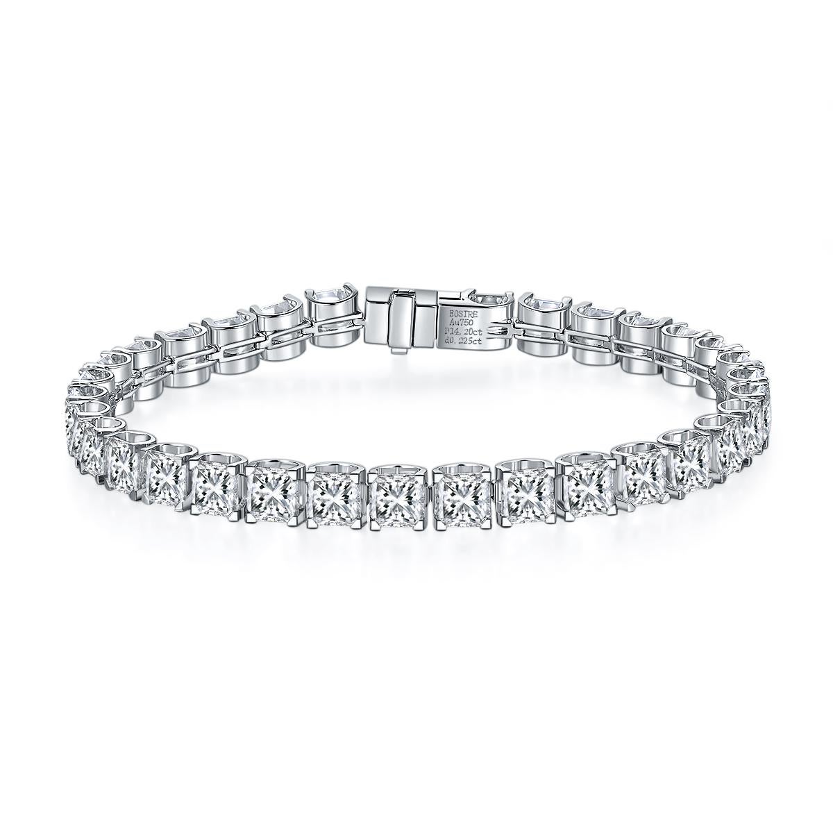 This breathtaking diamond statement tennis bracelet is newly crafted in solid 18k white gold and set with 32 fine quality and large Asscher cut diamonds. The diamonds are mounted in solid and sturdy, squared 4-prong baskets with the most comfortable
