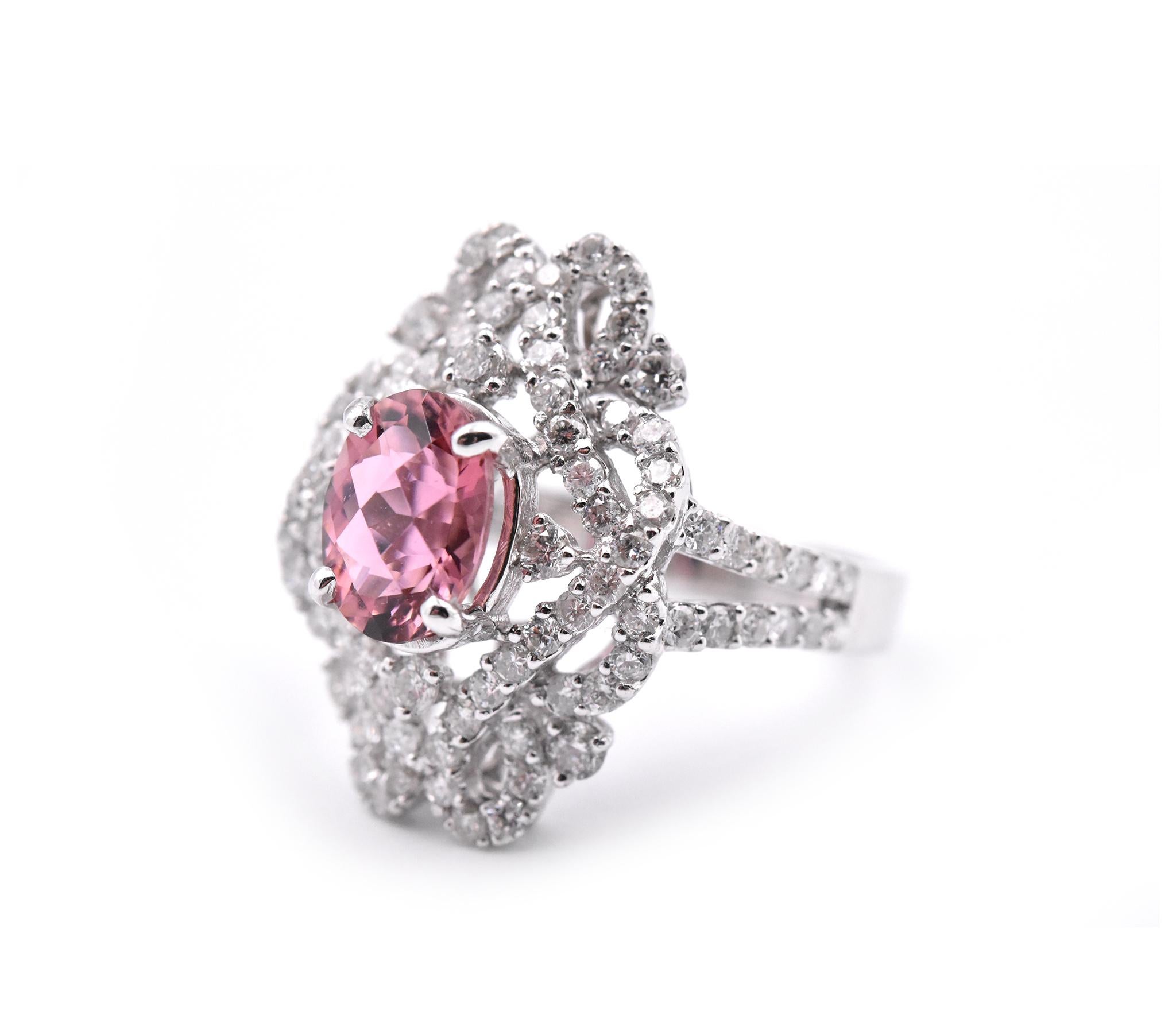 Designer: custom 
Material: 18k white gold
Gemstone: 1 oval cut pink tourmaline = 1.84ct
Diamonds: round brilliant cuts = 1.88cttw
Color: G-H
Clarity: VS2-SI1
Ring Size: 7 ¾ (please allow two additional shipping days for sizing requests)
Dimensions: