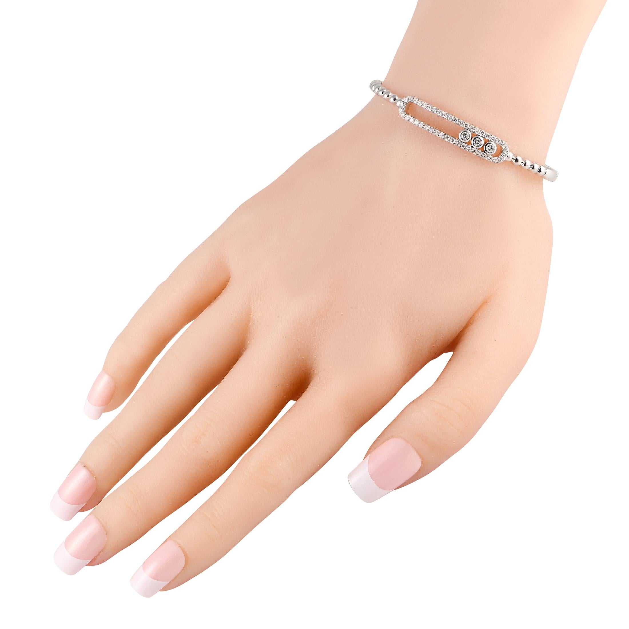 This luxurious 18K White Gold bracelet is designed to catch the light and capture your imagination. The classic horse bit is elevated thanks to sparkling inset Diamonds with a total weight of 1.85 carats. Simple and elegant, it measures 7.0