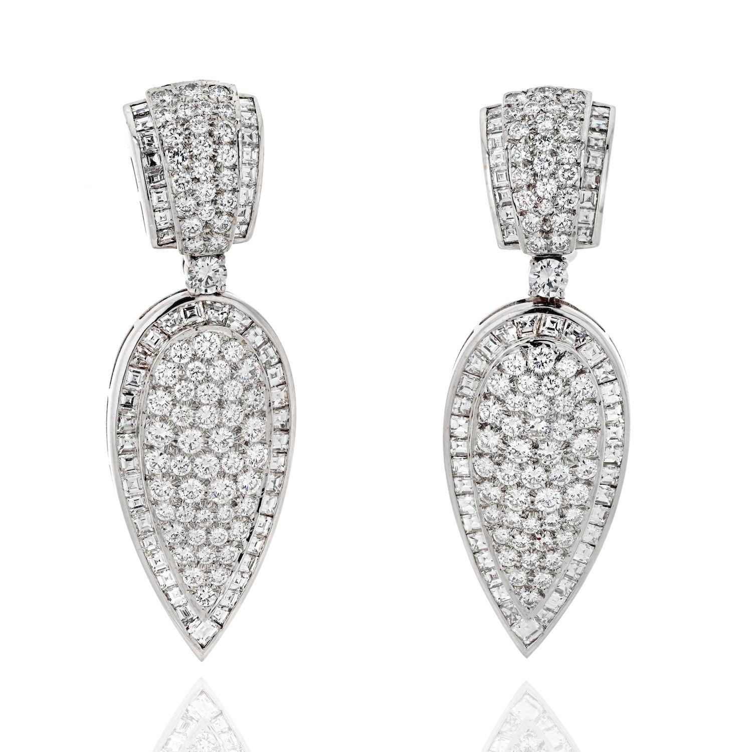 Add instant elegance to your outfit when you put these wonderful teardrop pave set diamond earrings on. 
Encrusted with 19.00cttw of round cut and baguette cut diamonds these earrimgs are designed for pierced ears and measure 6cm long. 
Diamond