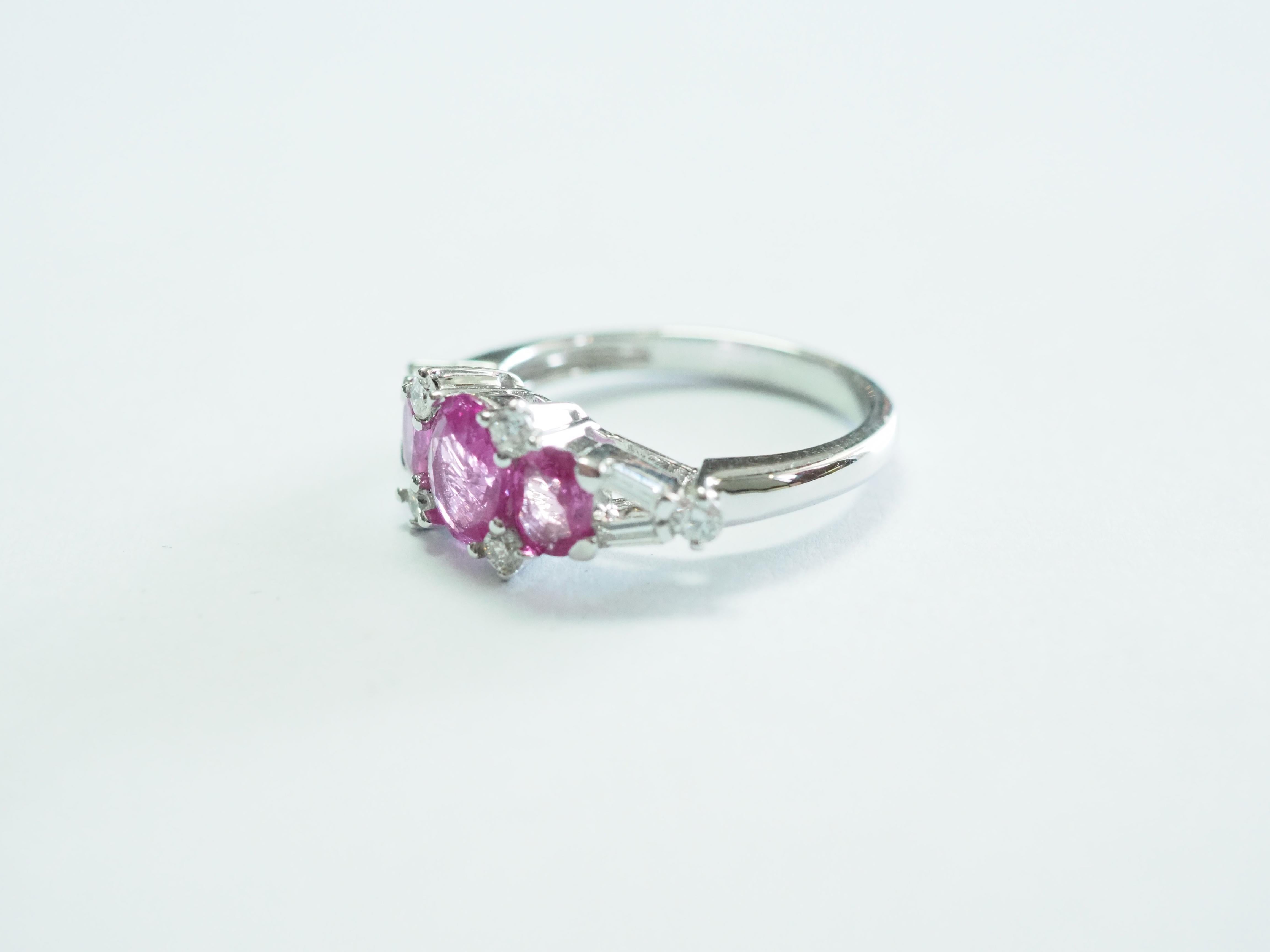 Auction Estimate:
$625 - $2,800

This quality and beautiful engagement piece is an 18K white gold fine quality pink sapphire and diamond ring. 3 bubblegum oval pink sapphires are set meticulously and at the center is the largest one. There are 4 of