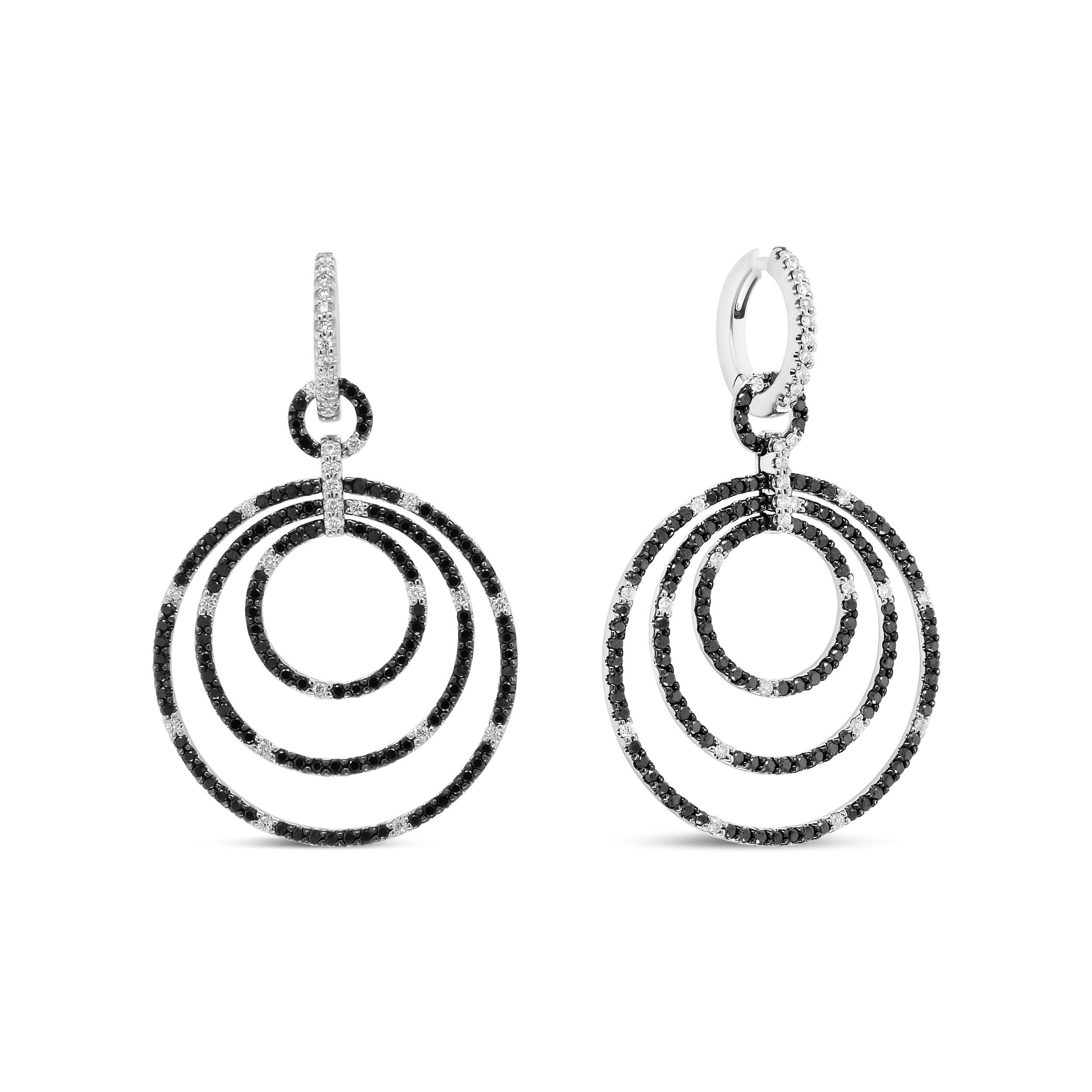 These diamonds dangle earrings are just like your favorite LBD in that they go with everything and are effortlessly timeless! Graduated hoops with a diameter of 14mm to 30mm showcase the splendor of a total 2 1/3 cttw round diamonds with an