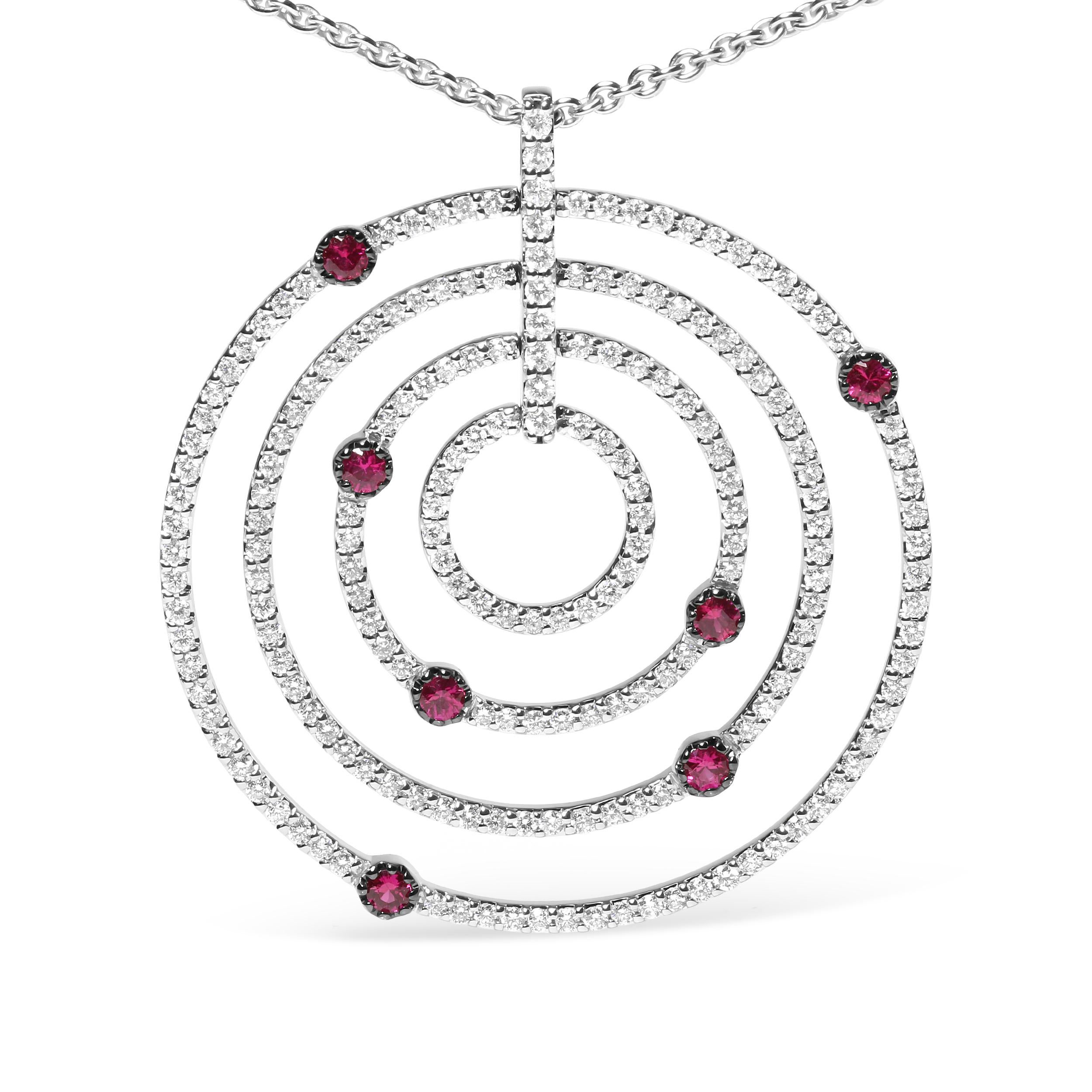 This statement pendant necklace showcases multiple rows of sparkling round diamonds pave-set in concentric openwork circles cast in 18k white gold. These diamonds shimmer and shine in a total 2 1/6 cttw with an approximate G-H Color and SI2-I1