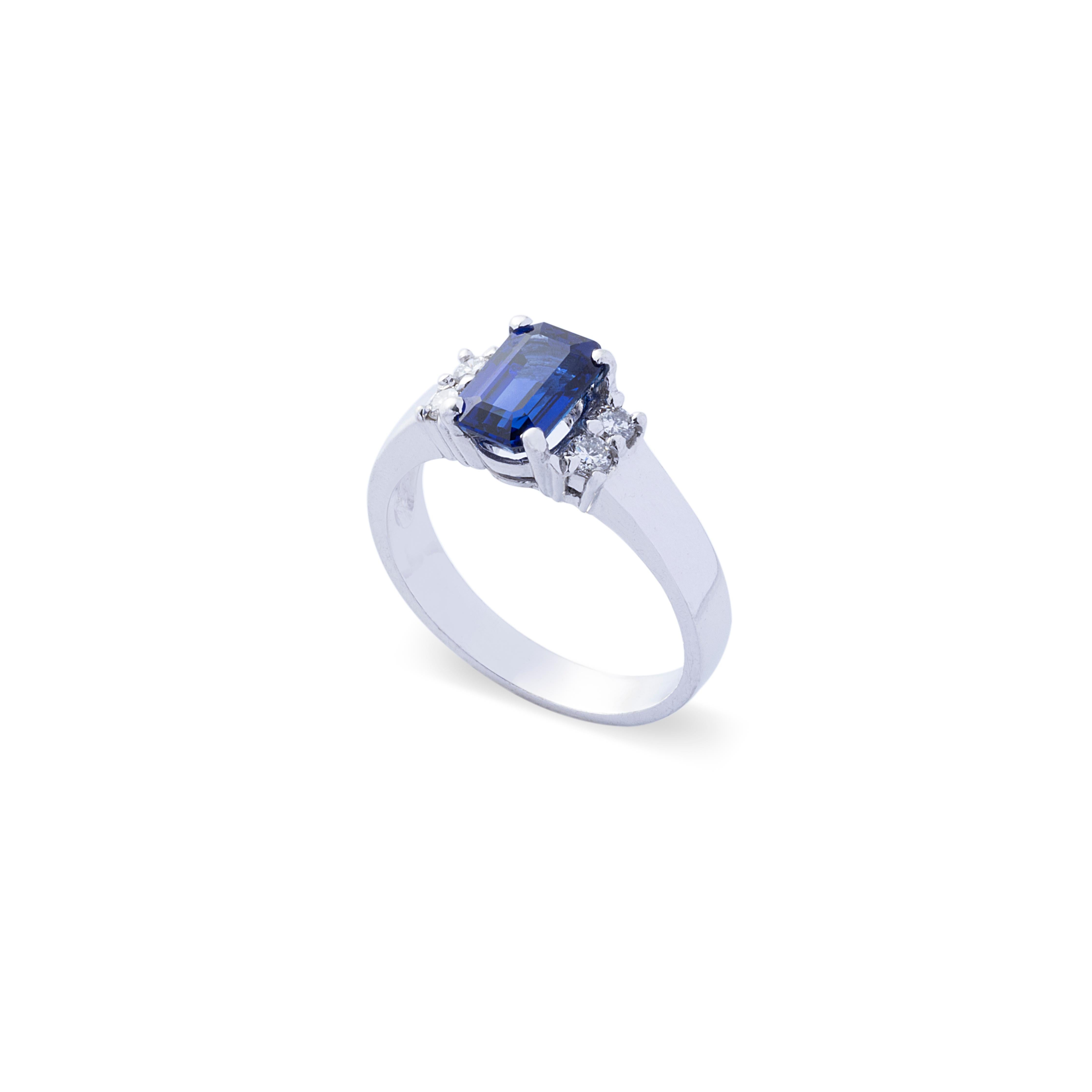 Estimate: $2,200-$3,500

This beautiful engagement ring boasts a very stunning cornflower blue sapphire! The sapphire is an emerald cut and is very clear and eye-clean with high saturation of blue color. There are 4 decent round brilliant diamonds