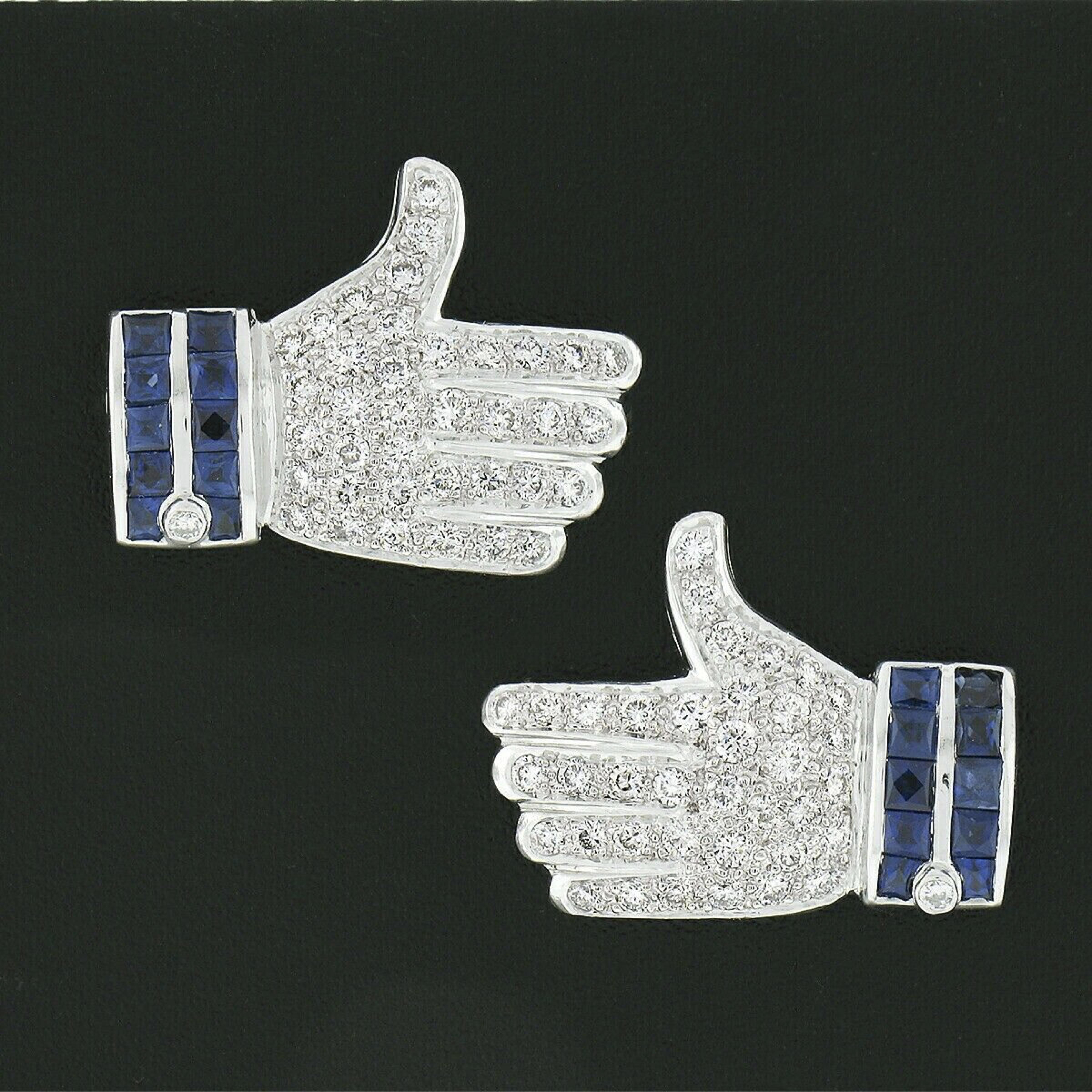 This super fun pair of earrings are very well crafted in solid 18k &14k white gold and feature a thumbs up or 