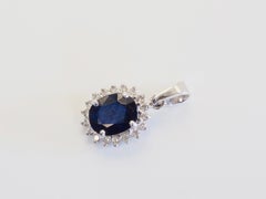18K White Gold 2.10ct Deep Blue Sapphire & 0.24ct Brilliant Diamond Halo Pendant
