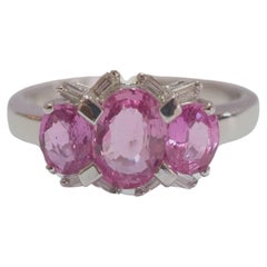 18K White Gold 2.10ct Three Pink Sapphires 
0.10ct Baguette Diamond Ring