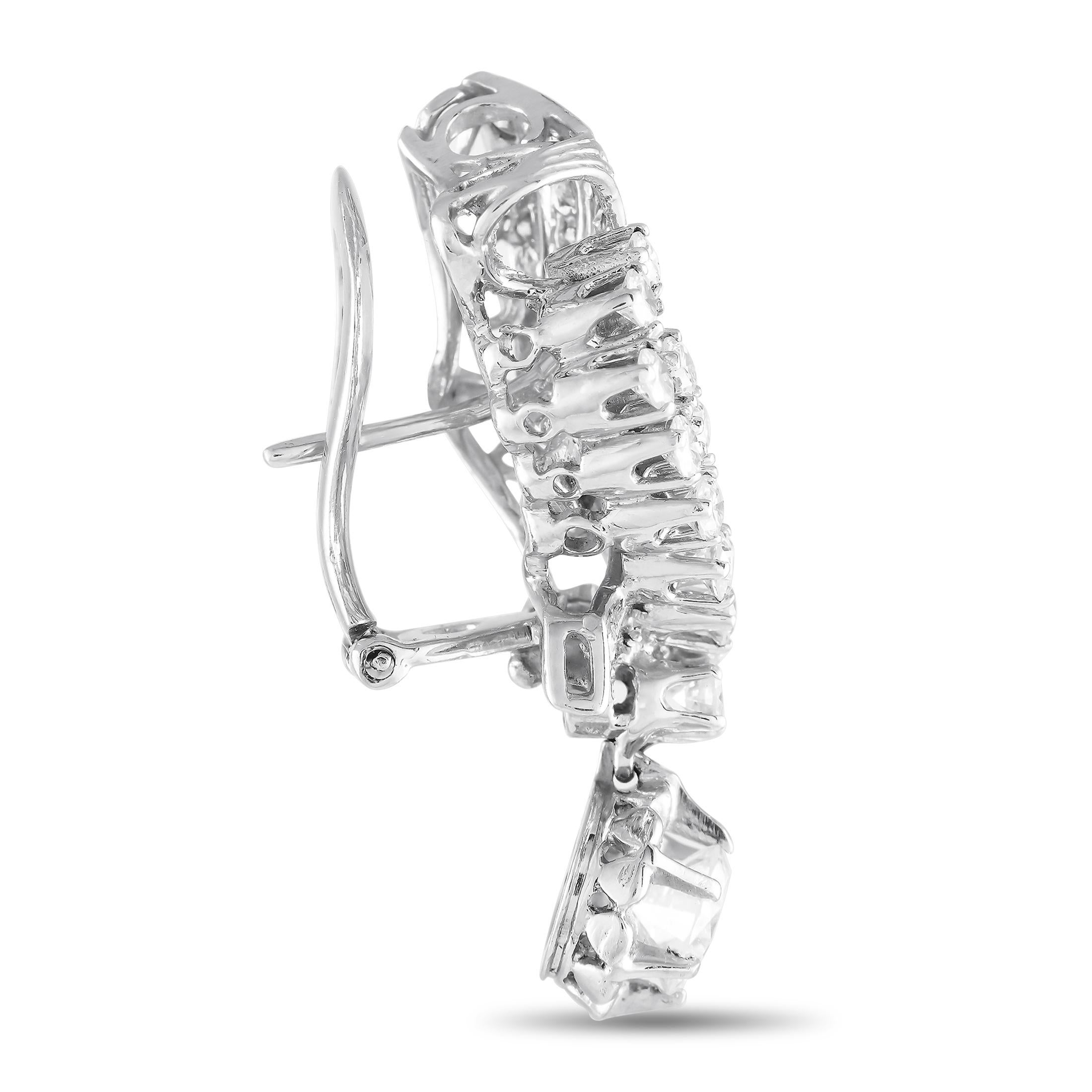 These white gold beauties are ready to frame your face and bring out the sparkle in your eyes. They come with a looped ribbon design, elaborately detailed with round diamonds in tapering sizes that total 1.18 carats. A small circular frame dotted