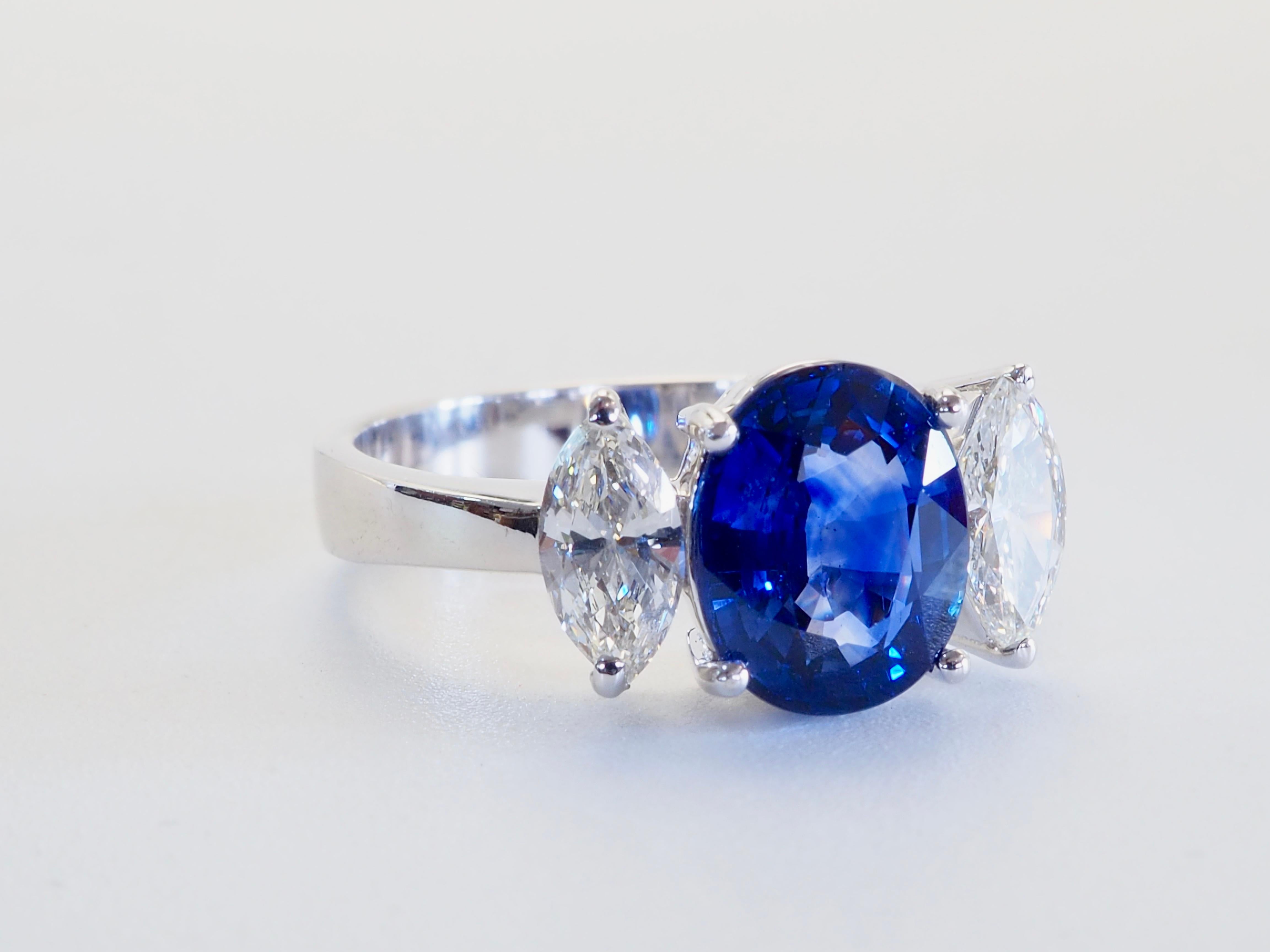 Women's 18K White Gold 2.29ct Vivid Blue Sapphire & 0.57ct Marquise Diamond Ring For Sale