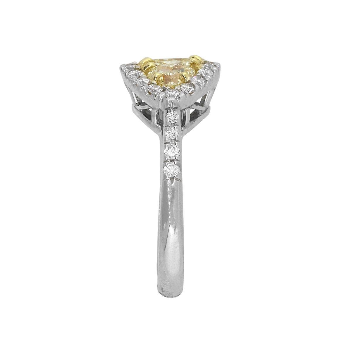 Material: 18k White Gold
Fancy Diamond Details: Approx. 0.91ctw Cushion cut Diamond. Diamond is fancy yellow in color and SI in clarity
                                        Approx. 0.90ctw of Heart shaped diamonds. Diamonds are Fancy yellow in