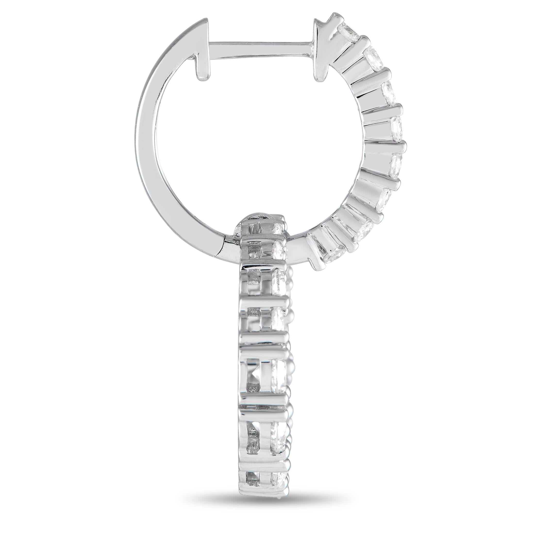 Diamonds with a total weight of 2.37 carats allow these simple, elegant earrings to seemingly radiate light. Crafted from 18K white gold, each one features a circular design and measures 1.0 long by 0.65 wide.This jewelry piece is offered in brand