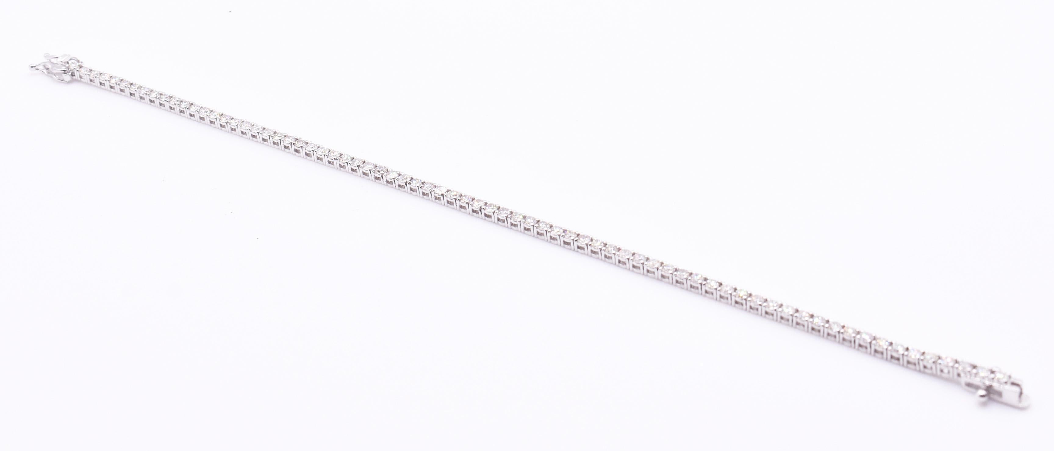 On offer for sale is a superb 18k white gold diamond tennis bracelet, having 72 round cut diamonds, with a total weight of 2.46ct.

Length: 7
