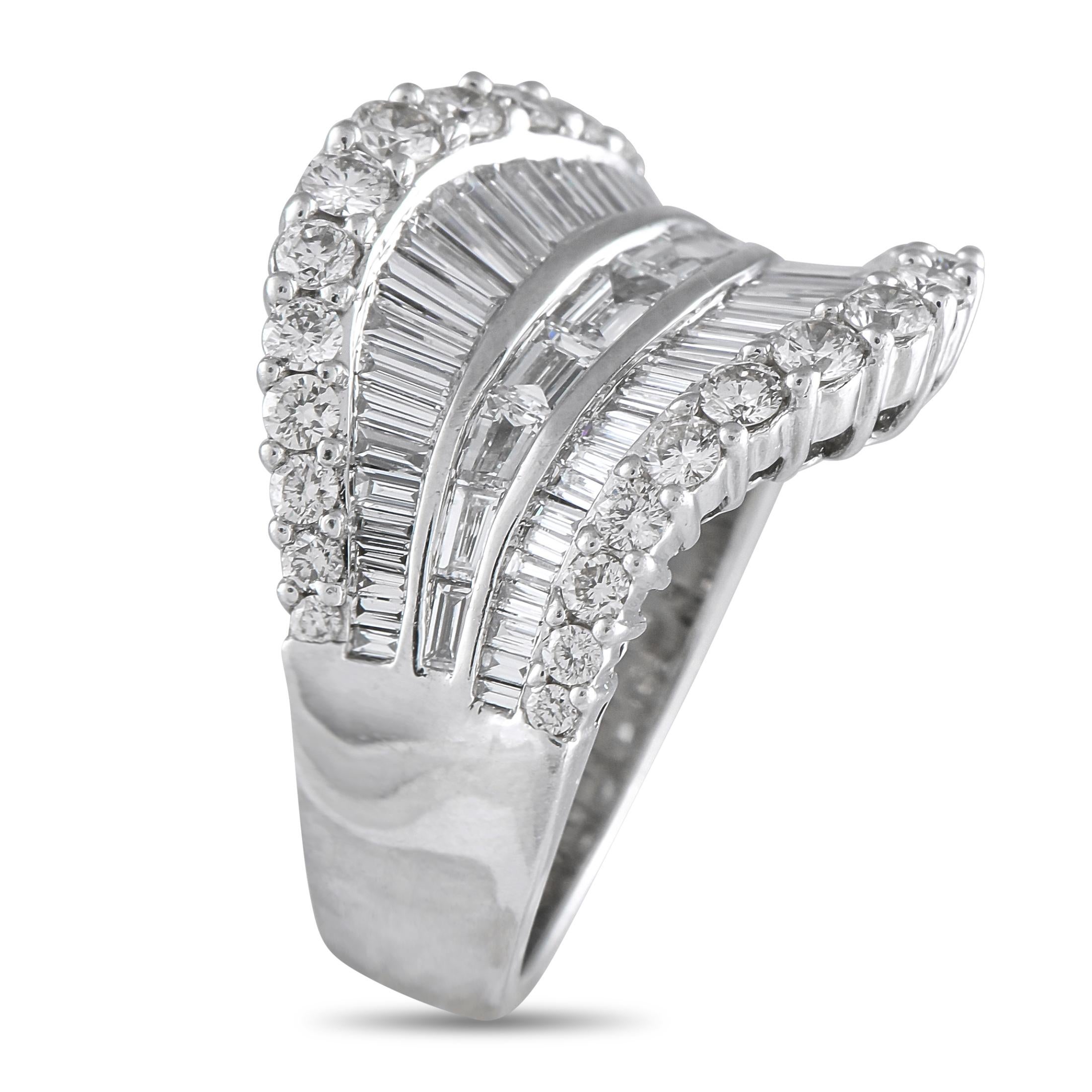 A curved 18K White Gold setting makes this luxury ring incredibly dramatic in design. Bold and breathtaking, round-cut Diamonds and Diamond baguettes with a total weight of 2.53 carats offer endless sparkle. This piece features a 4mm wide band and a