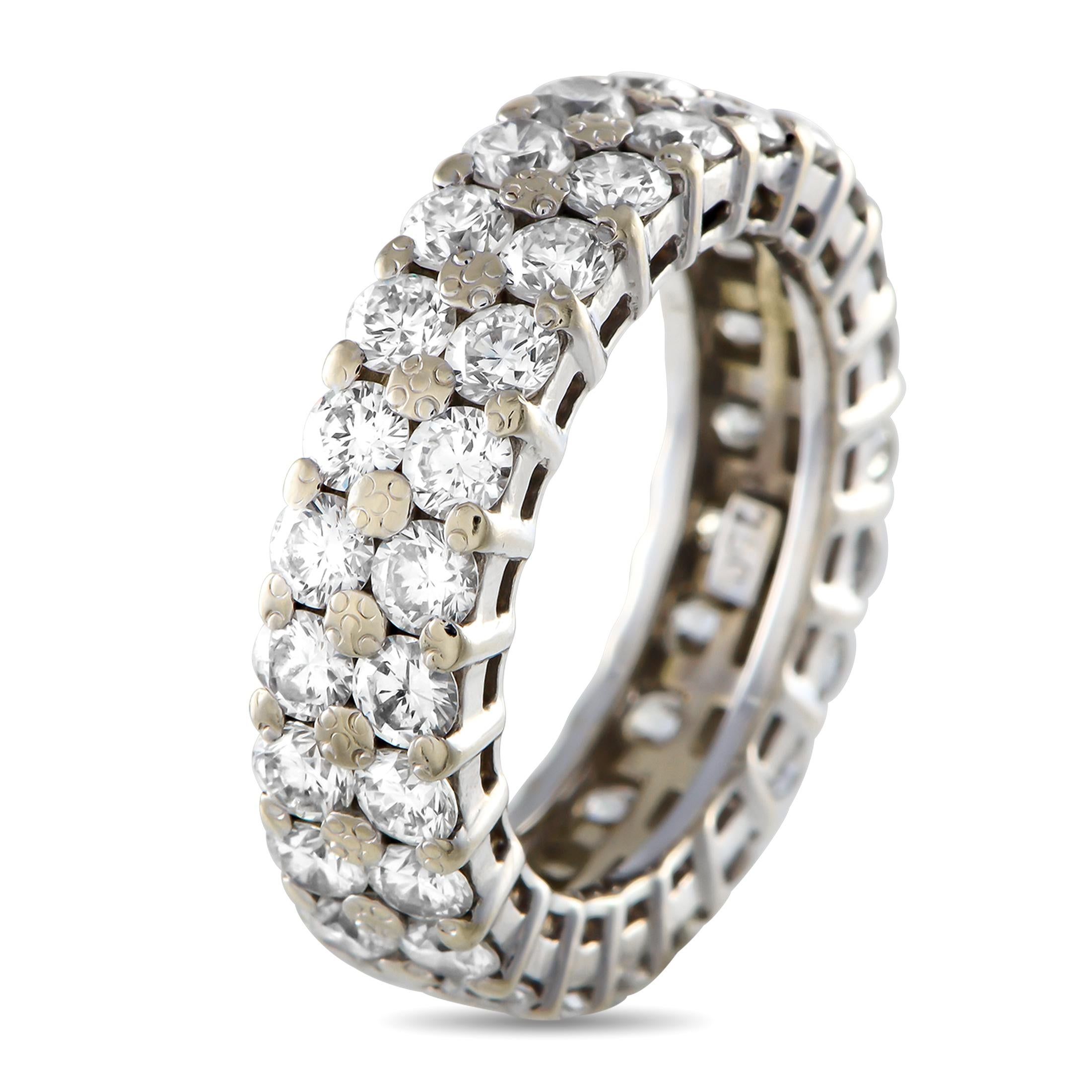 Featuring not one but two continuous lines of brilliant diamonds, this eternity ring truly stands for never-ending love. Celebrate your infinite connection and endless love with this diamond ring. The band is made of 18K white gold and carefully