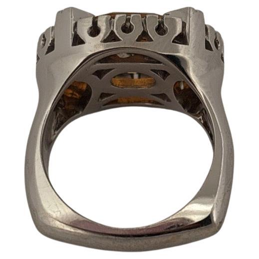 This exquisite 18k white gold ring showcases a captivating 2.85-carat oval citrine, radiating a warm golden-orange brilliance. Expertly faceted, the citrine is prong-set to maximize its vibrant sparkle and fiery depth, immediately drawing attention