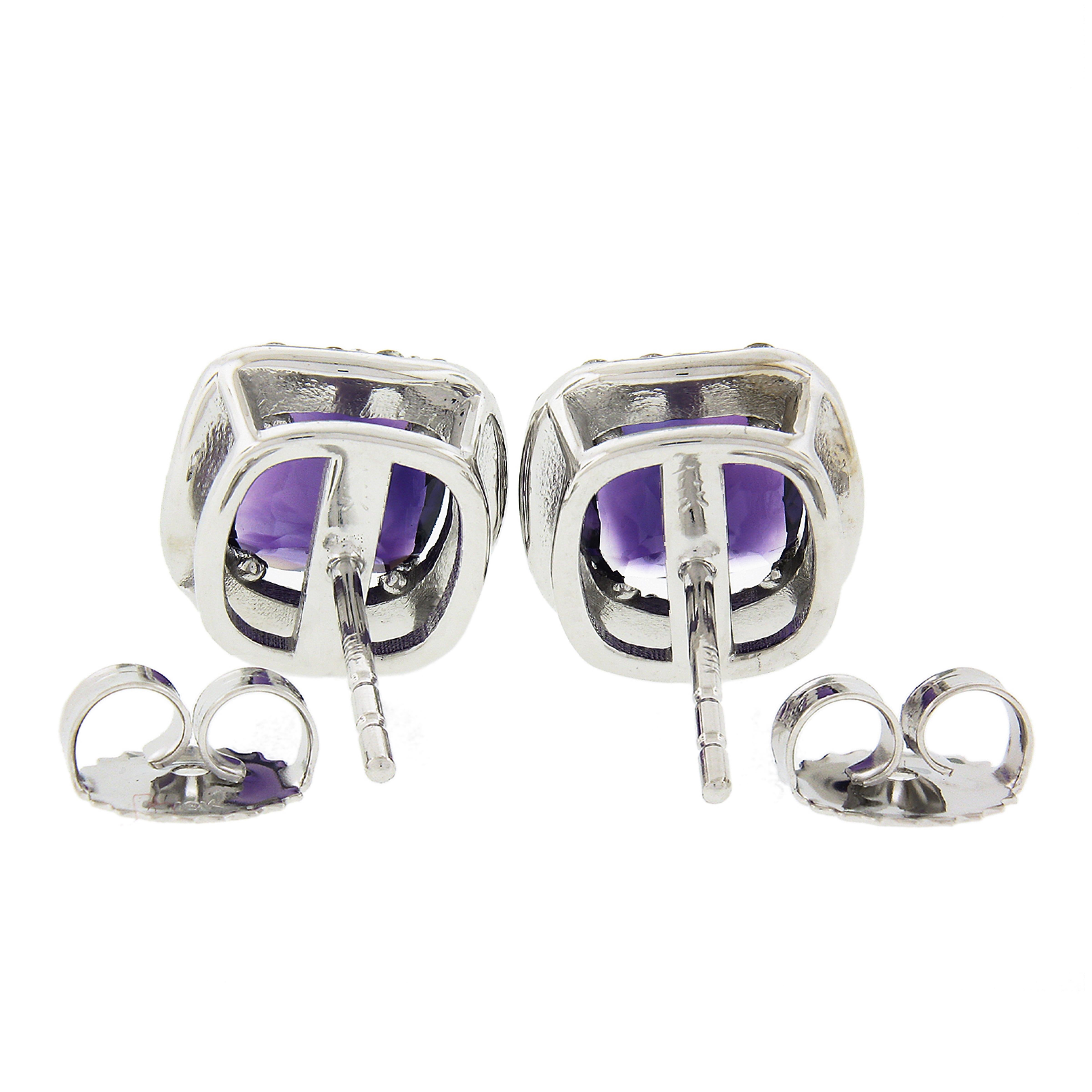 You are looking at magnificent brand new pair of amethyst and diamond stud earrings solidly and very well crafted in 18k white gold. The fine quality amethysts are cushion brilliant cuts and weigh 2.40 carats in weight. They are neatly prong set and