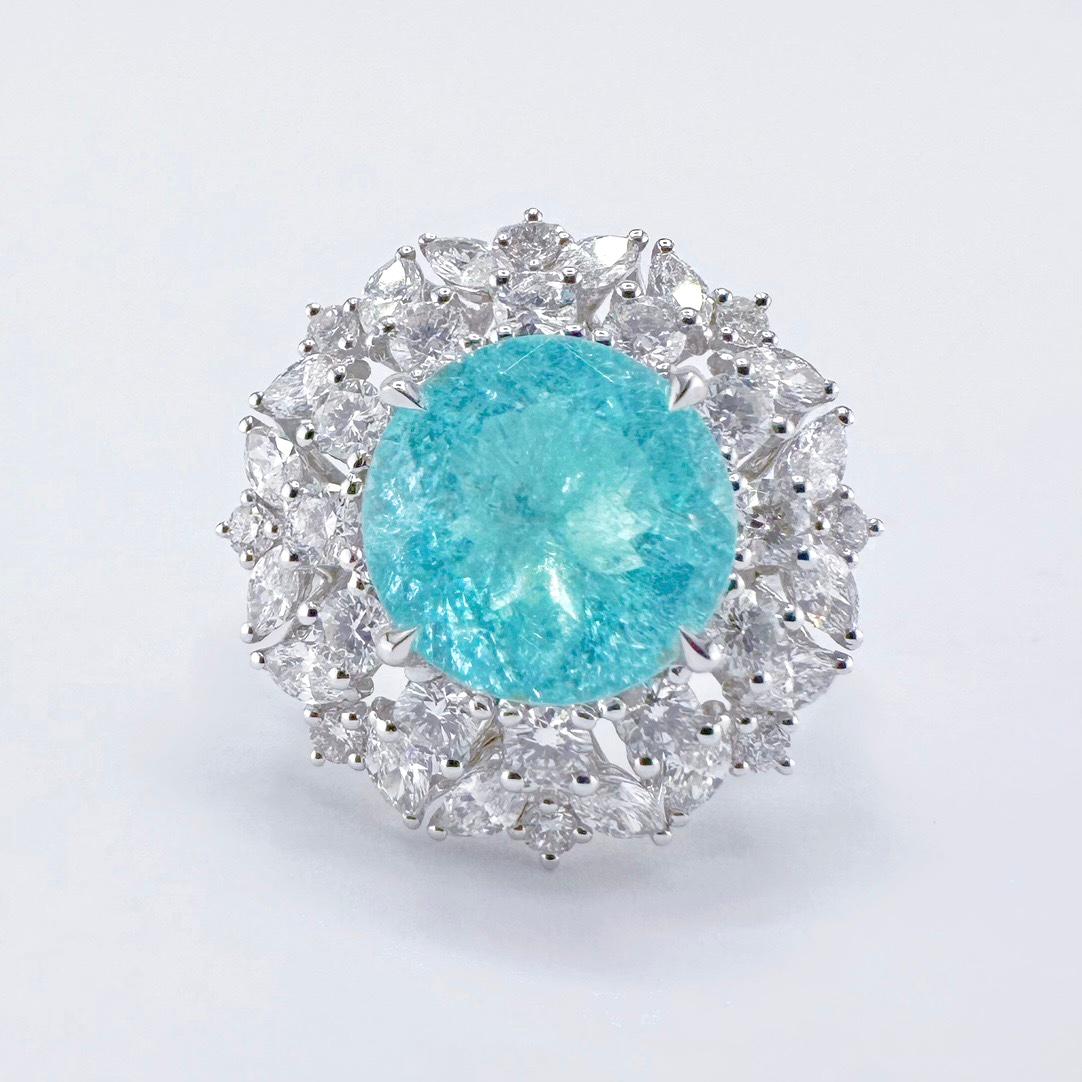 Bague cocktail en or blanc 18K avec diamants et tourmaline Paraiba de 2,95 CT

1 Tourmaline Paraiba - 2,95 CT
Diamants - 1,65 CT

Or 18K - 8.25 GM