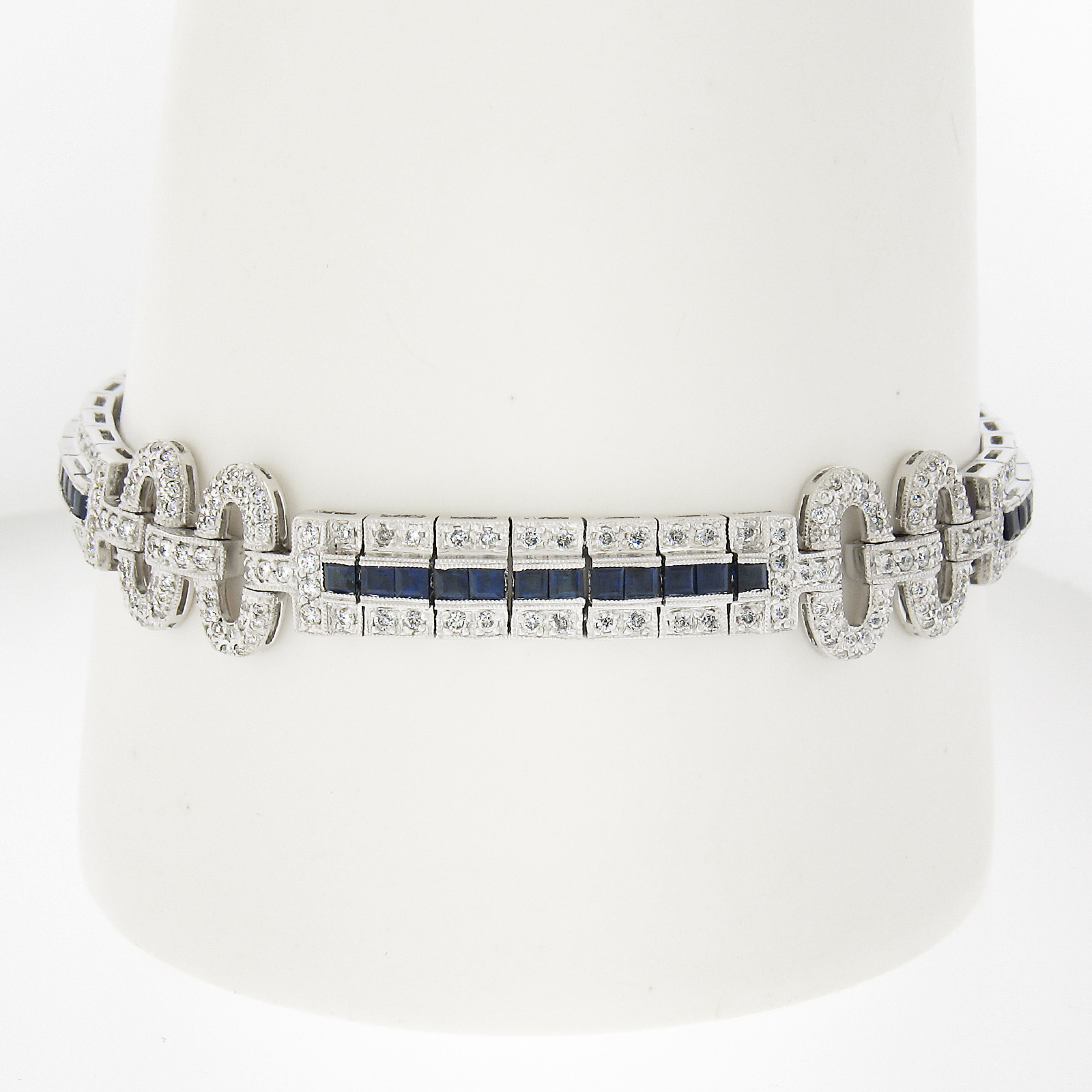 Stones:
408 Natural Genuine Diamonds - Round Brilliant Cut - Pave Set - G-I Color - VS2-I1 Clarity - 2.0ctw approx.
48 Natural Genuine Sapphires - Square Step Cut - Channel Set - Royal Blue Color - 2mm each approx.

Material: 18k Solid White