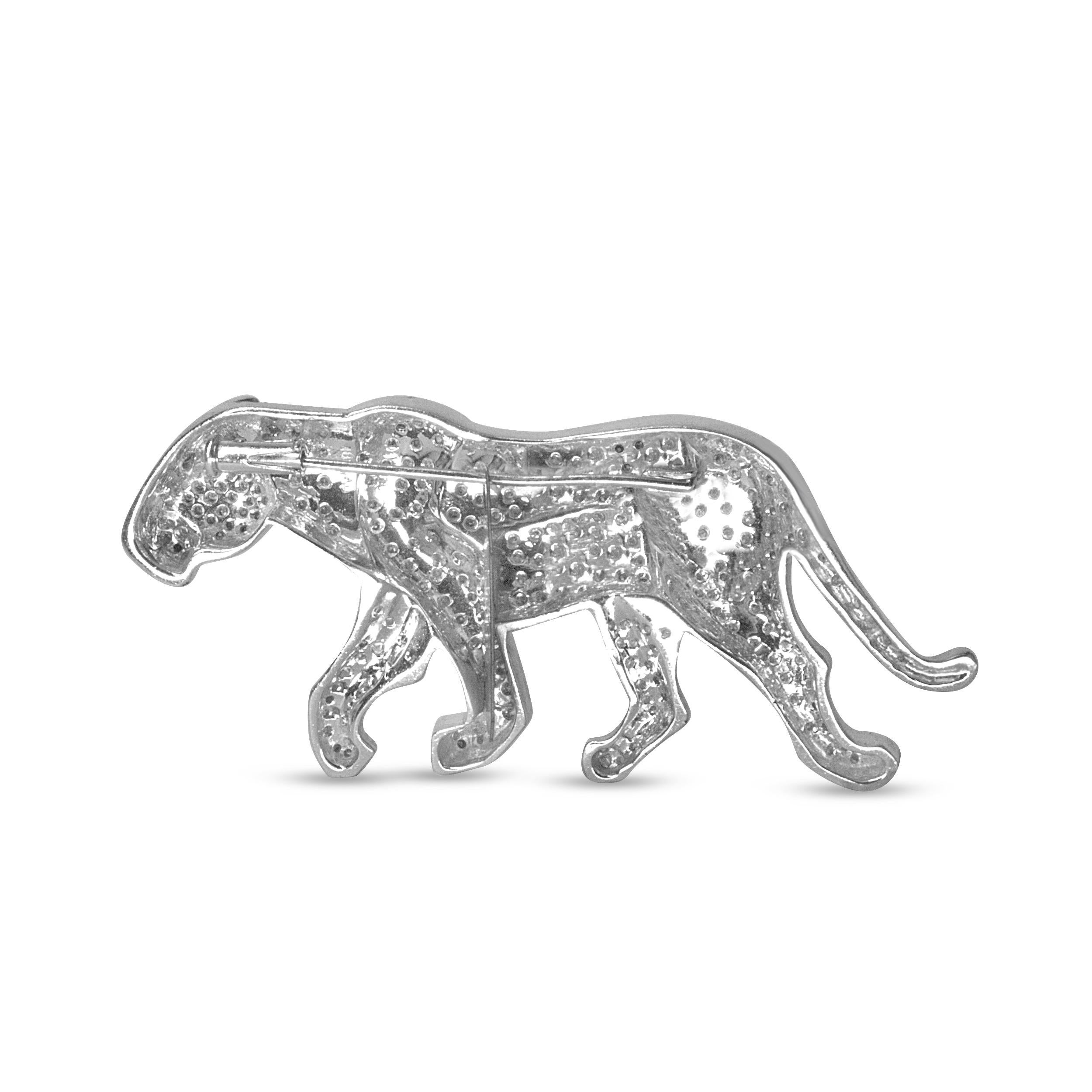 This fierce diamond brooch is set to steal the scene, crafted of genuine 18k white gold in the style of a prowling  panther with piercing 2mm round emerald eyes. The panther is a feline that has long been esteemed as a symbol of great power, grace,