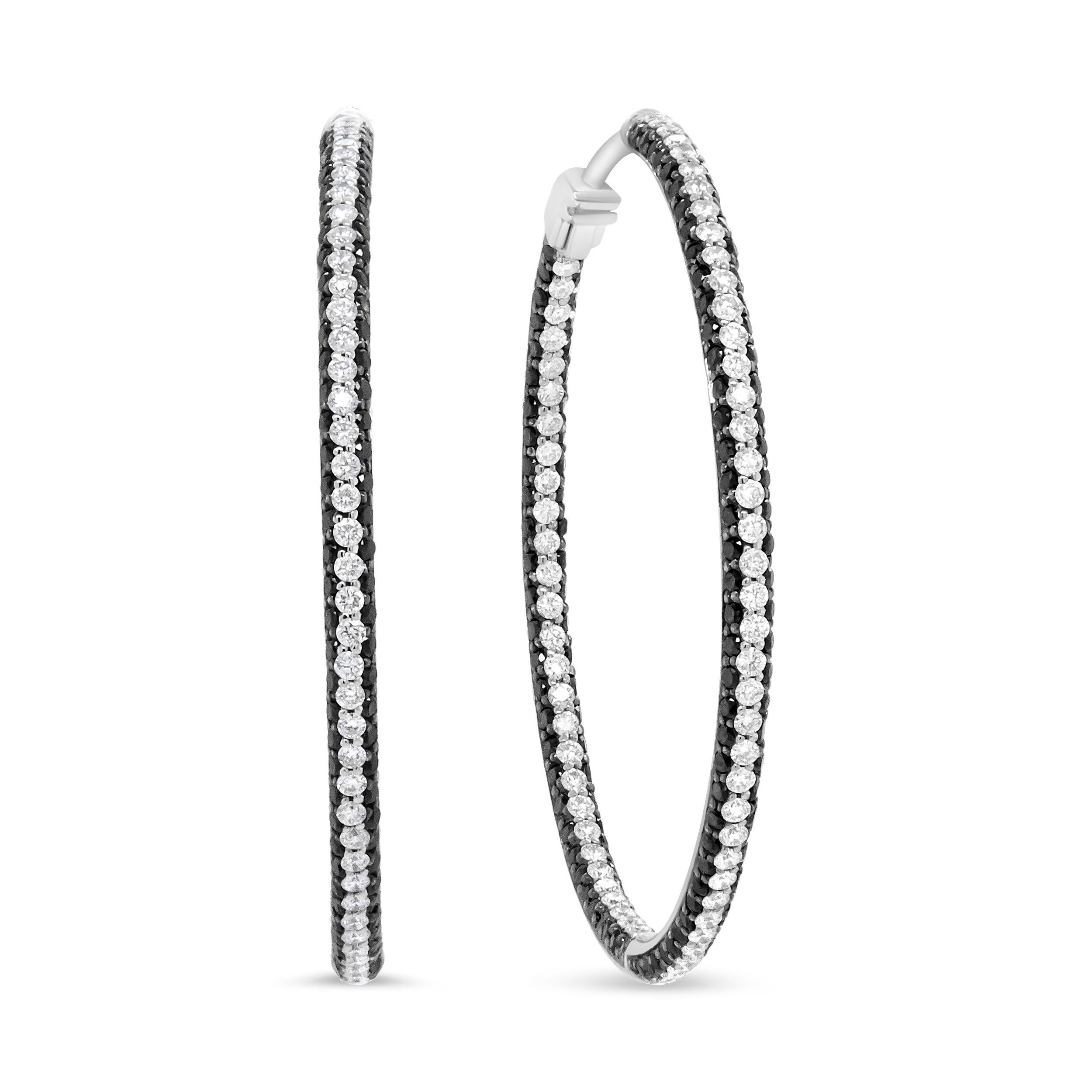 The classic hoops you love to wear have never looked so enticing! These modern inside-outside hoops feature the sparkle of 3 1/4 cttw round diamonds of an approximate Black and F-G Color with VS1-VS2 Clarity. These 18k white gold earrings shimmer