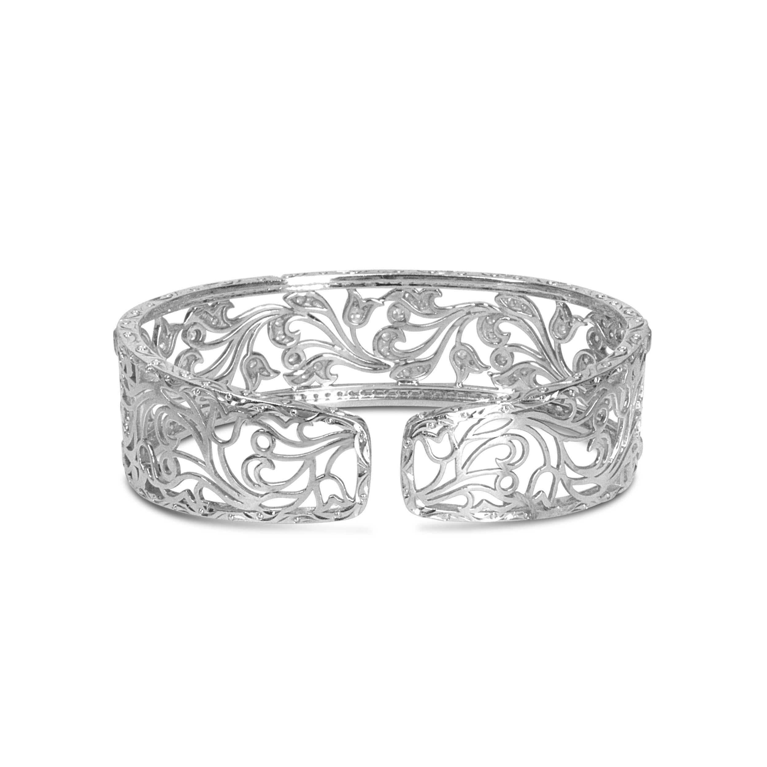 This resplendent openwork bangle cuff is a showpiece with 164 round white diamonds in an elegance-enhancing pave setting. A magnificent openwork floral filigree swirl design makes this piece of jewelry stunning, and it radiates a luminous sparkle