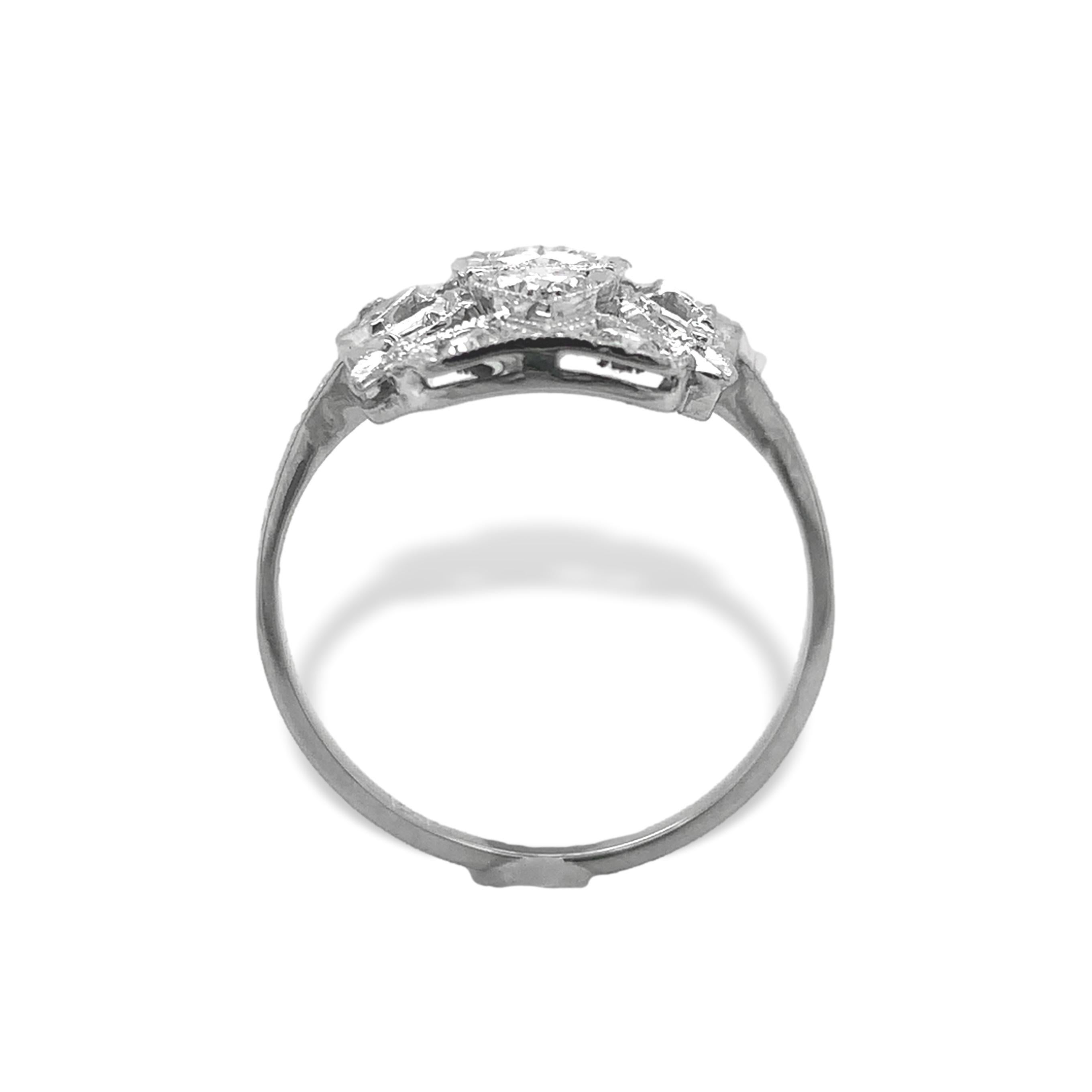 18K white gold filigree ring with diamonds. There are 13 round diamonds weighing about .75cts total. There is some hand engraved detail on the band. The natural earth mined diamonds are a mix of round brilliant cut and single cut. The center diamond