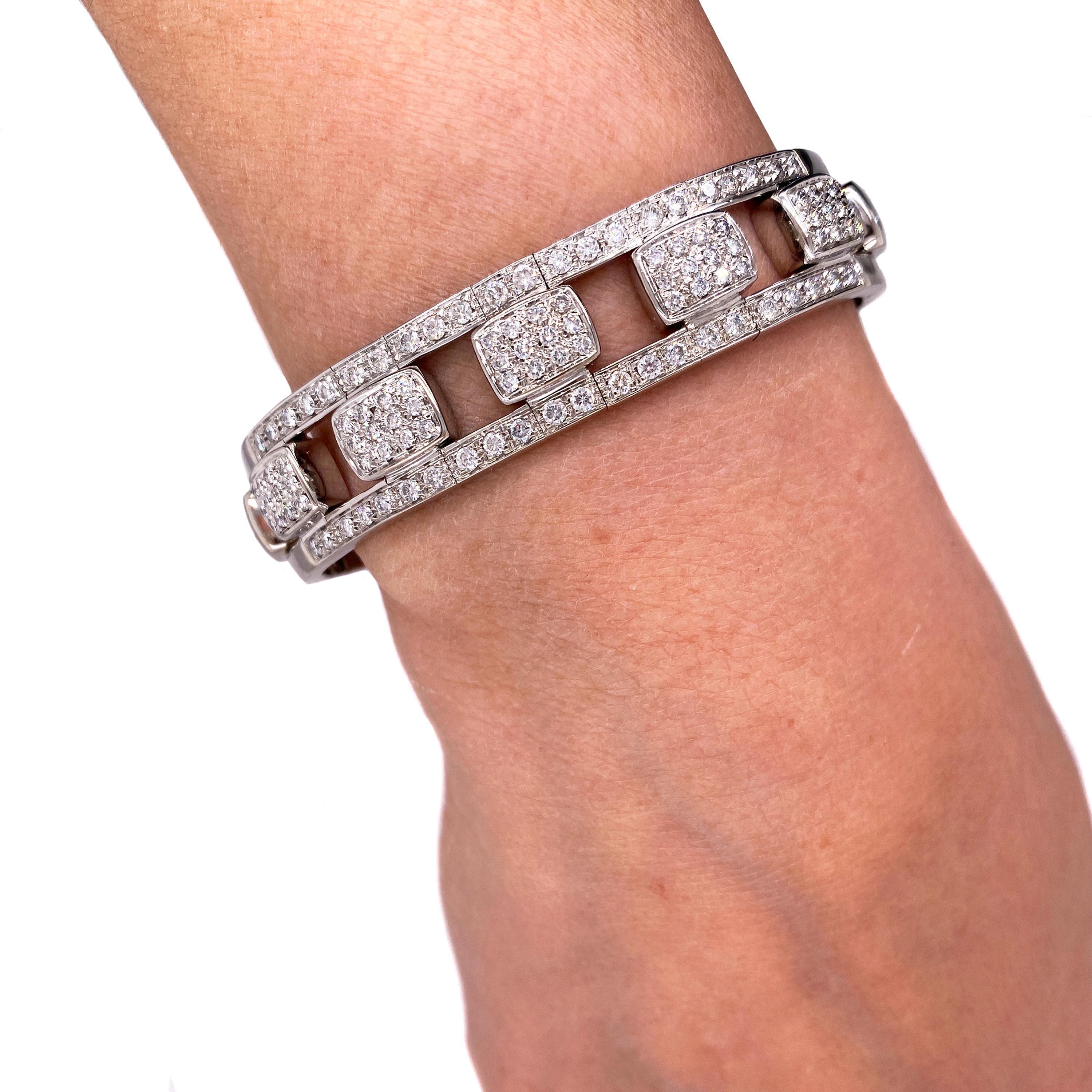 18K White Gold 3 Carats Pavé Set Diamonds Flexible Bangle Bracelet

This flexible bracelet stretches open to wear. There is a slight opening that allows the bangle to open and sit tight when worn.

Apprx. 3 carat G color, VS clarity diamonds total